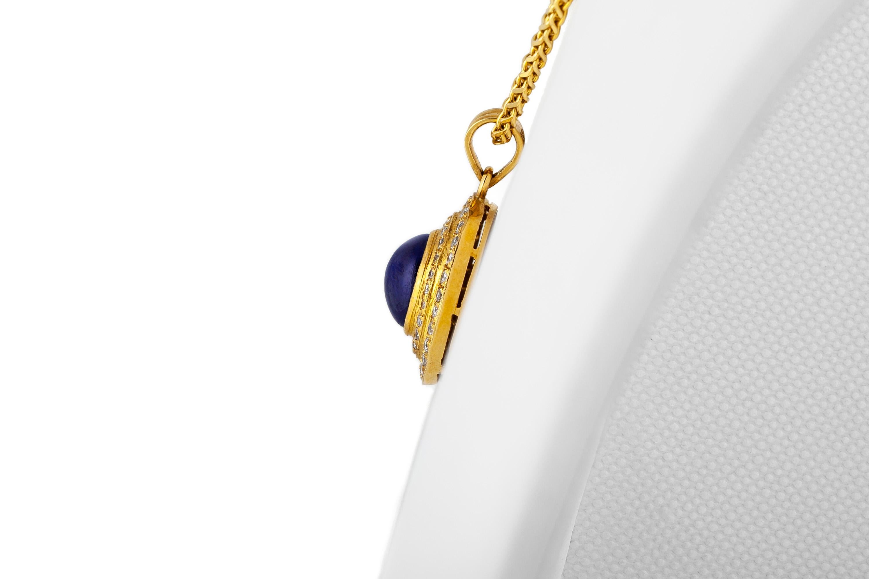 The pendant finely crafted in 18k yellow gold with center caboshon sapphire weighing approximately total of 3.00 carat and diamonds around weighing approximately total of 1.30 carat.
Circa 1980.