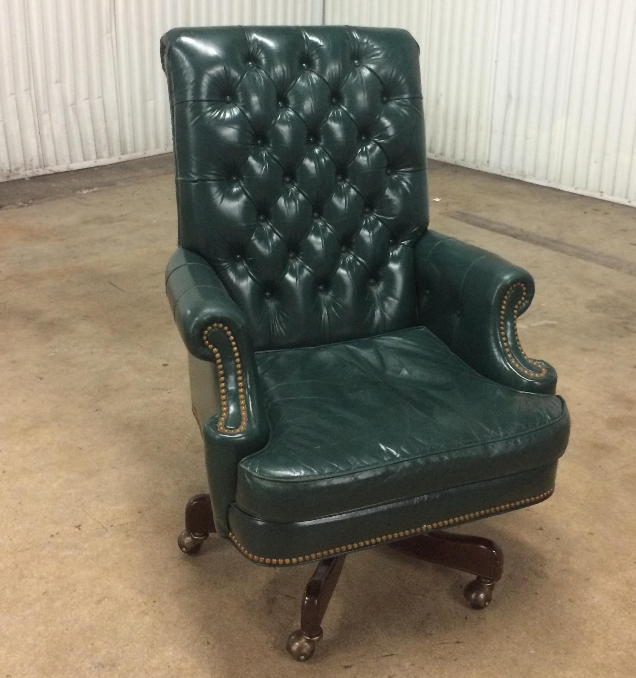 High quality green leather office chair by Cabot Wrenn. Tilts and adjust in height. Tufted leather
with brass nail decoration. Classic style executives chair.