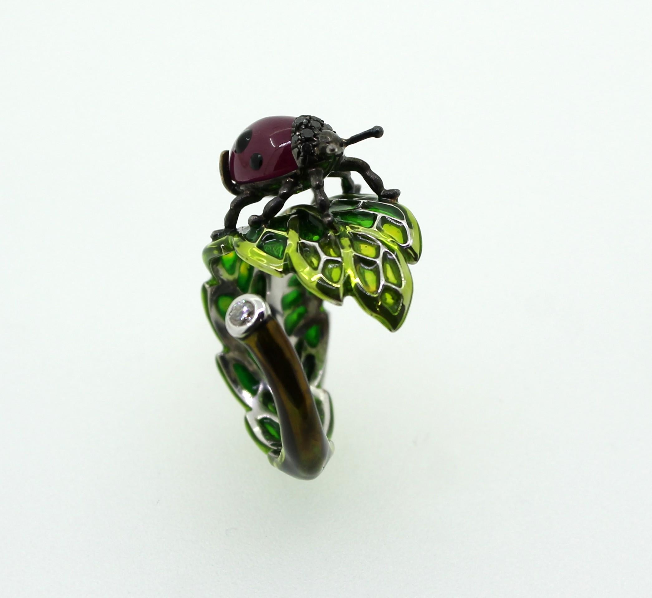 Summer Accessory and good luck Cocktail Ring.
An Hand-Enameled Green Leaf wrapped around itself and a Ruby ​​Ladybug as a guest.
Hand-Made Ladybug composed by 1 Cabouchon Ruby of 4.65 Carats and 0.06 Carats of Black Diamonds. 
0.06 Carat White