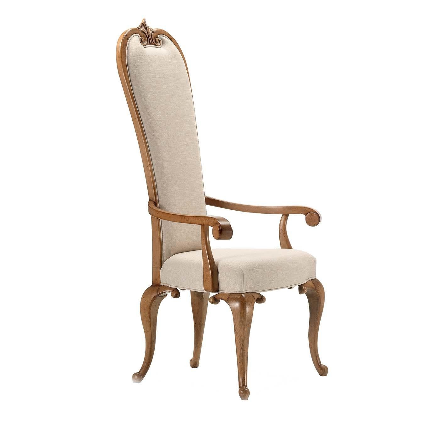 Inspired by Baroque lavishness and boasting a sensual and refined silhouette, this chair with armrests will infuse charm in a dining room, foyer, or be a stately addition to a study desk. The solid wood frame is crafted by hand and exudes
