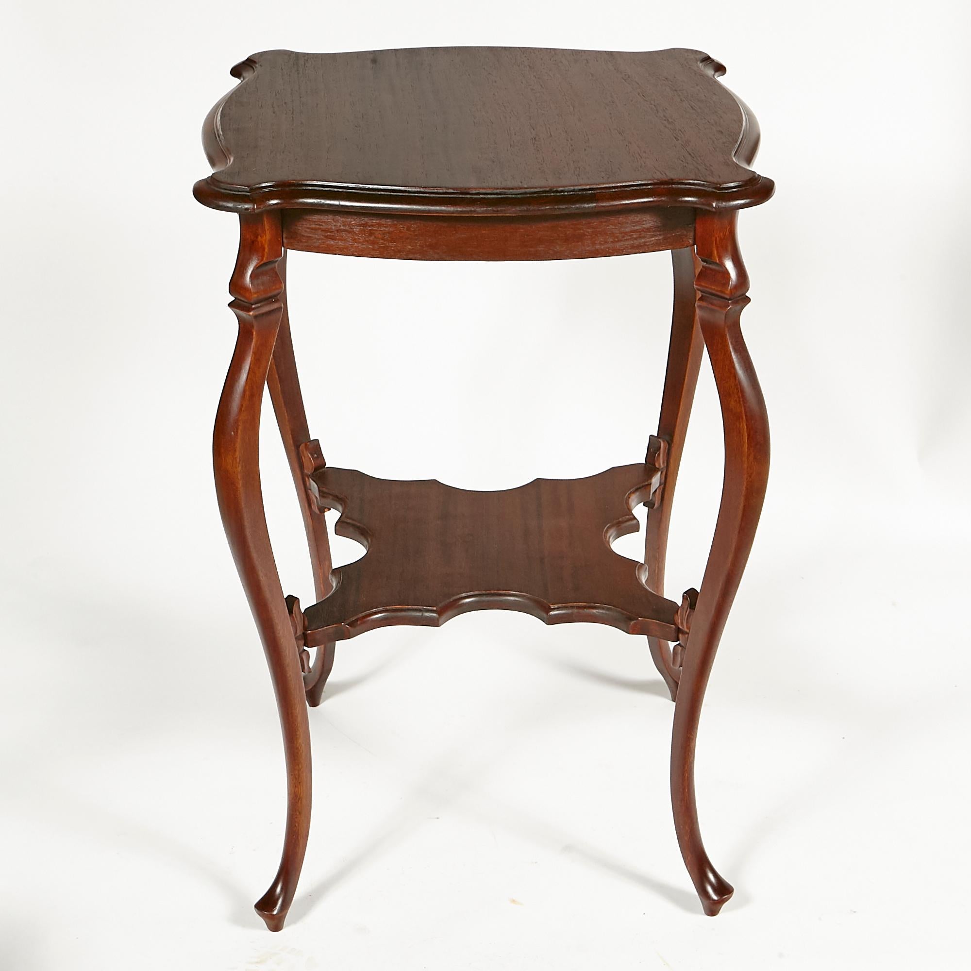 Vintage early 1900s side table or plant stand with scalloped edges and cabriole legs. In newly refinished condition. No maker's mark.