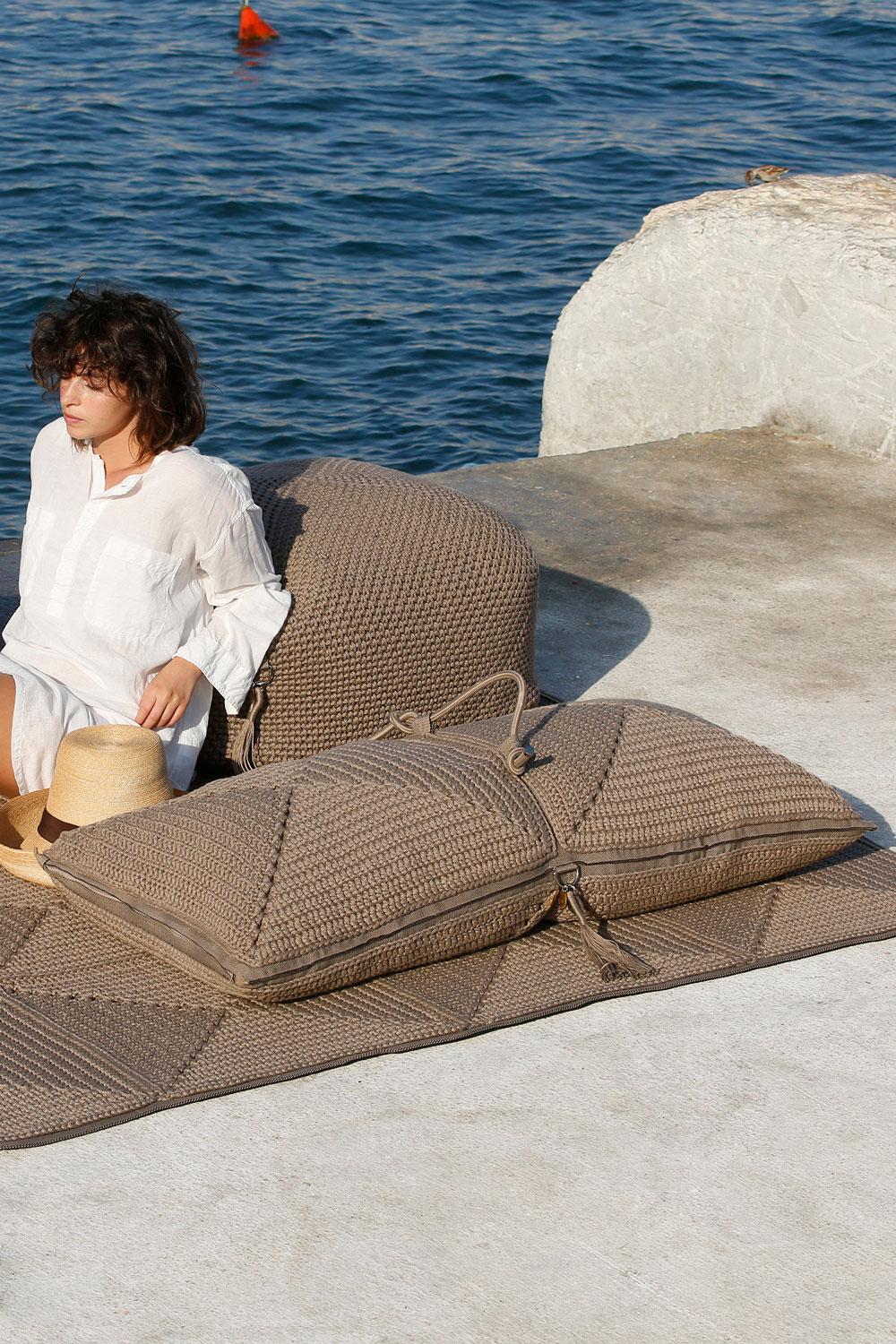 The Classic crochet granny square takes a contemporary twist in this large floor cushion. Four squares form the cushion which are than sewn together with bespoke outdoor webbing. It explores the aesthetics of nomads and wants to live both inside and