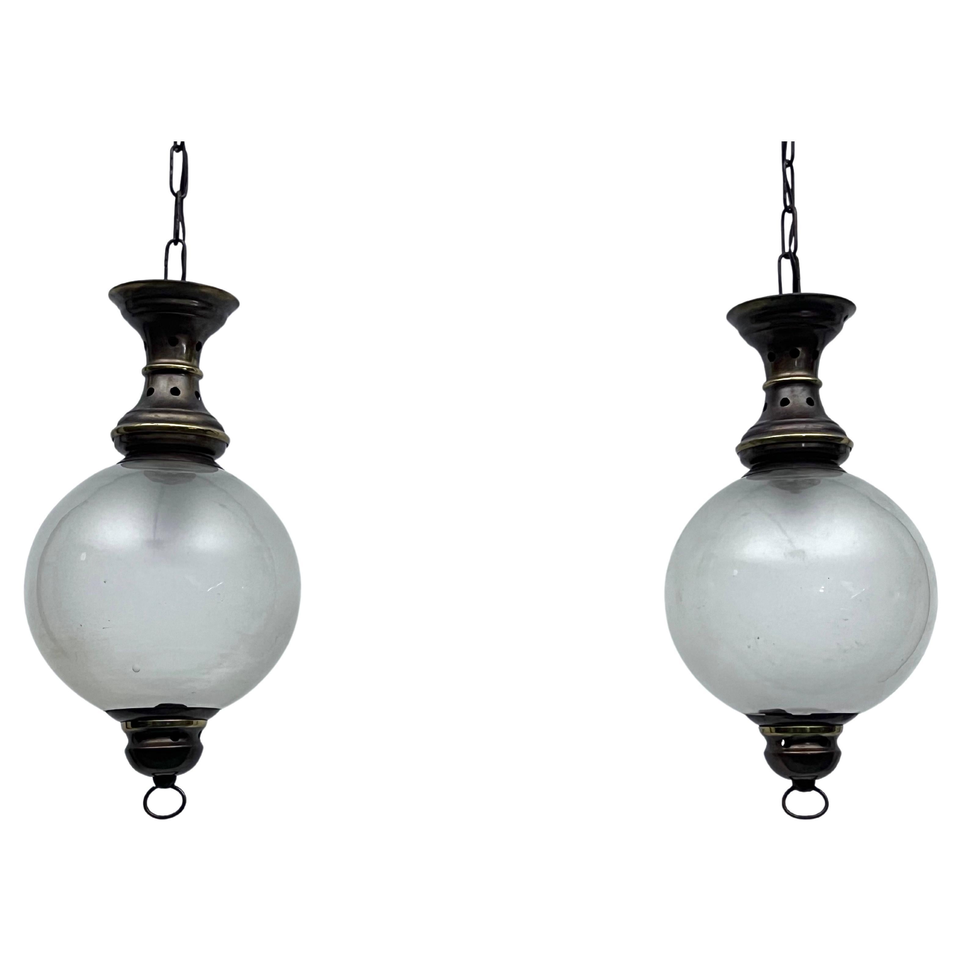 Caccia Dominioni manner, Pair of Mid-Century brass pendant lights. Italy 1950s