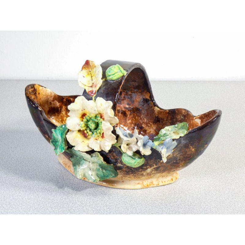 Cachepot vase, ceramic barbotine basket, decorated with flowers and leaves. France, 1920s.

Origin: France
Period: 1920s
Template: Cachepot vase, ceramic basket with decorative figures of flowers.
Materials: Painted and glazed