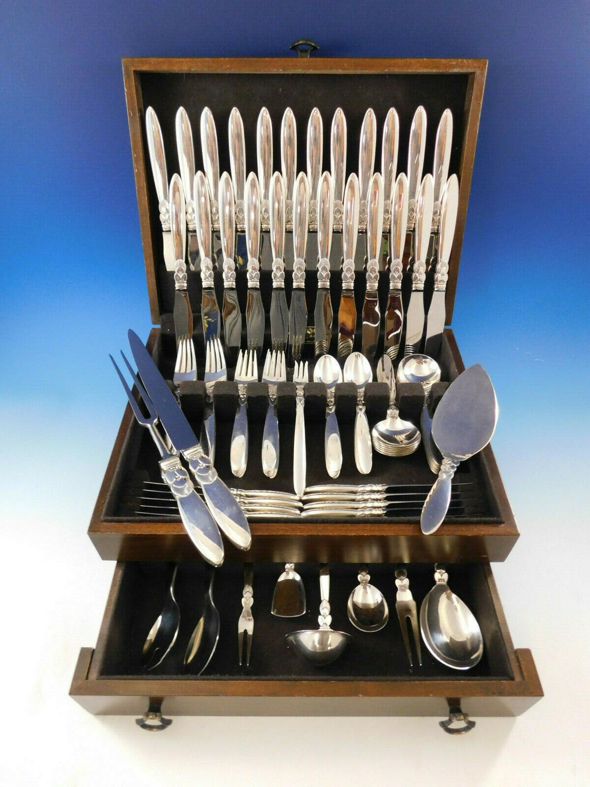 Superb dinner size Cactus by Georg Jensen Danish sterling silver flatware set - 107 pieces. This set includes:

12 dinner size knives, long handle, 9 1/4