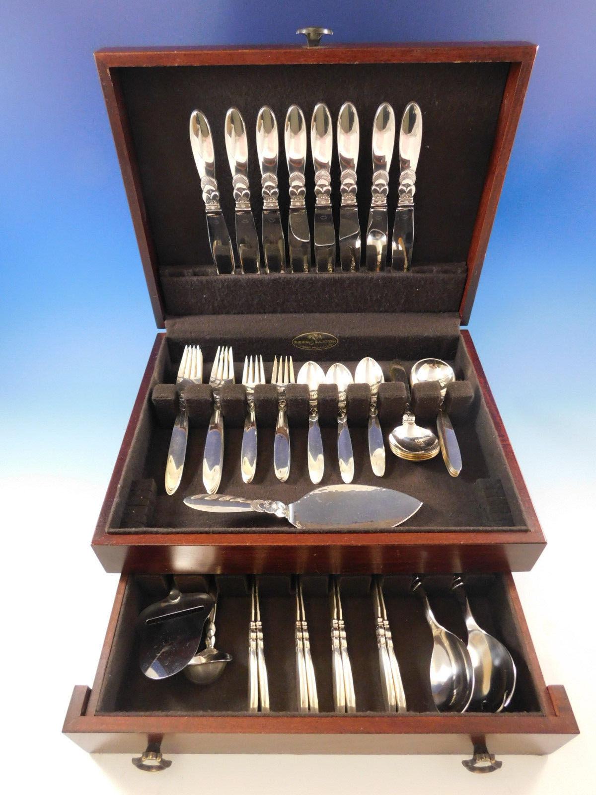Dinner size cactus by Georg Jensen sterling silver flatware set, 53 pieces. This set includes:

Eight dinner knives, short handle, 9