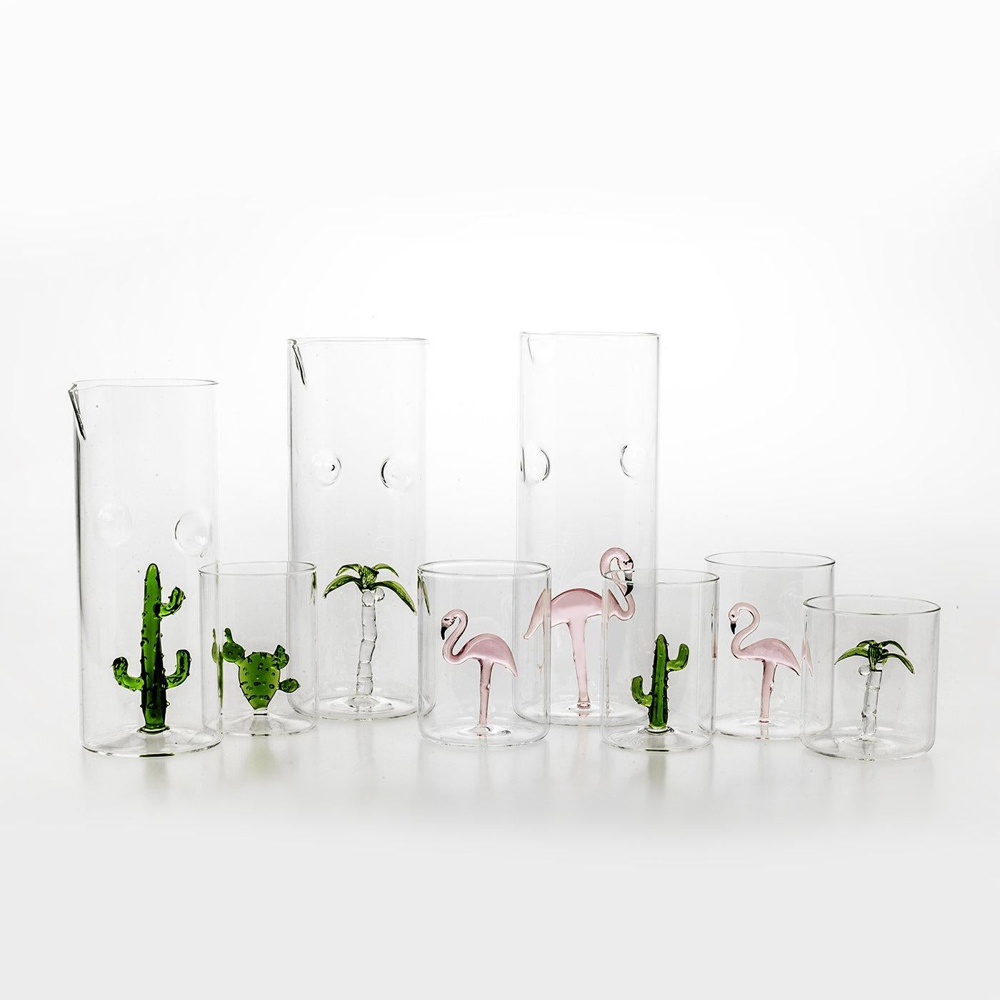 A stunning set that will add a special accent to any occasion, this set comprises one pitcher (8 x 22 cm) and four glasses (each 7 cm in diameter and 10 in height) that were handcrafted of clear glass, each adorned inside with a hand-painted, glass