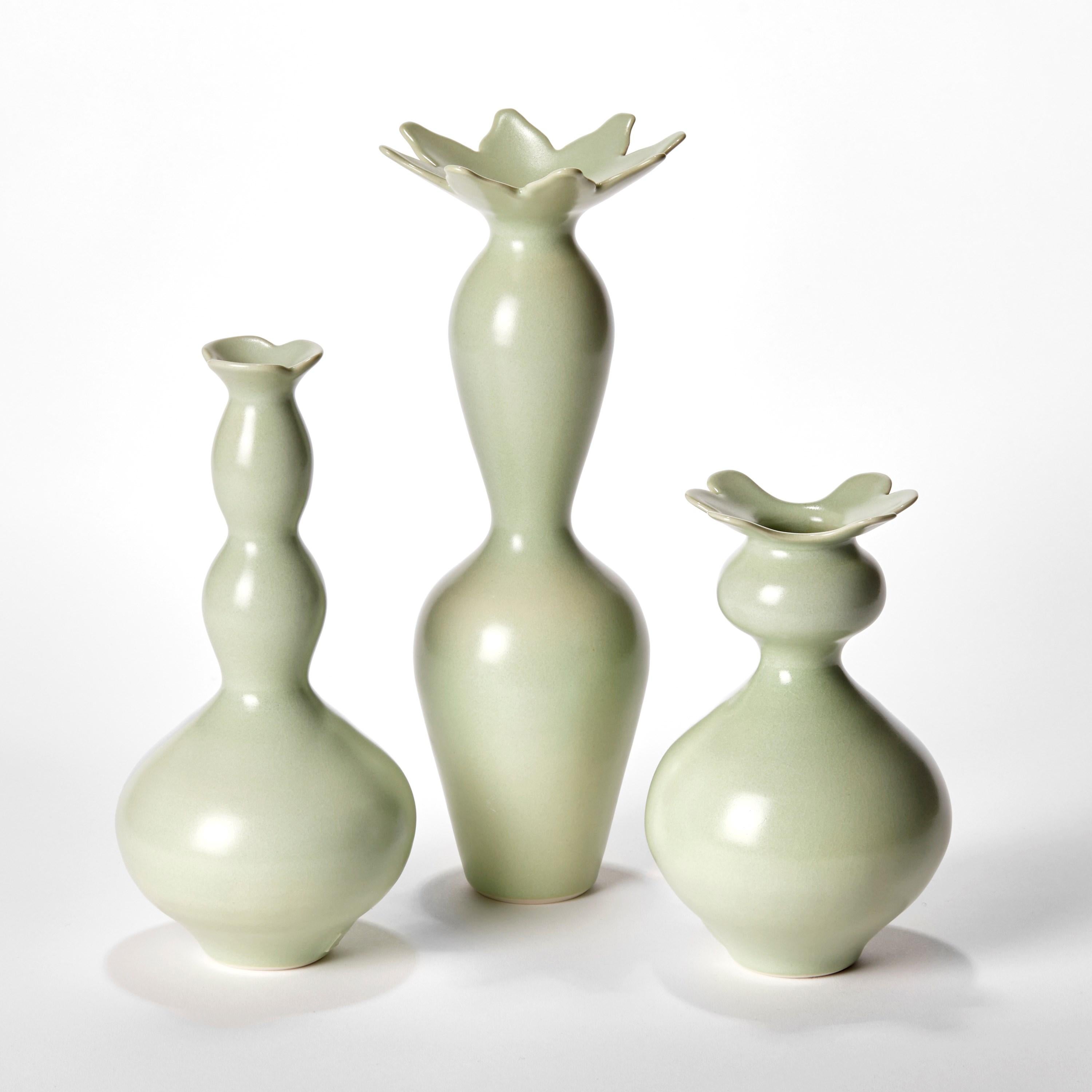 'Cactus Trio’ is a unique collection of porcelain sculptural vessels by the British artist, Vivienne Foley.

Left to right in the first image:

Apple Green Bobbin Cactus  H 25 cm W 11.5 cm D 11.5 cm 
Apple Green Tall Cactus  H 31.5 cm W 12 cm D 12