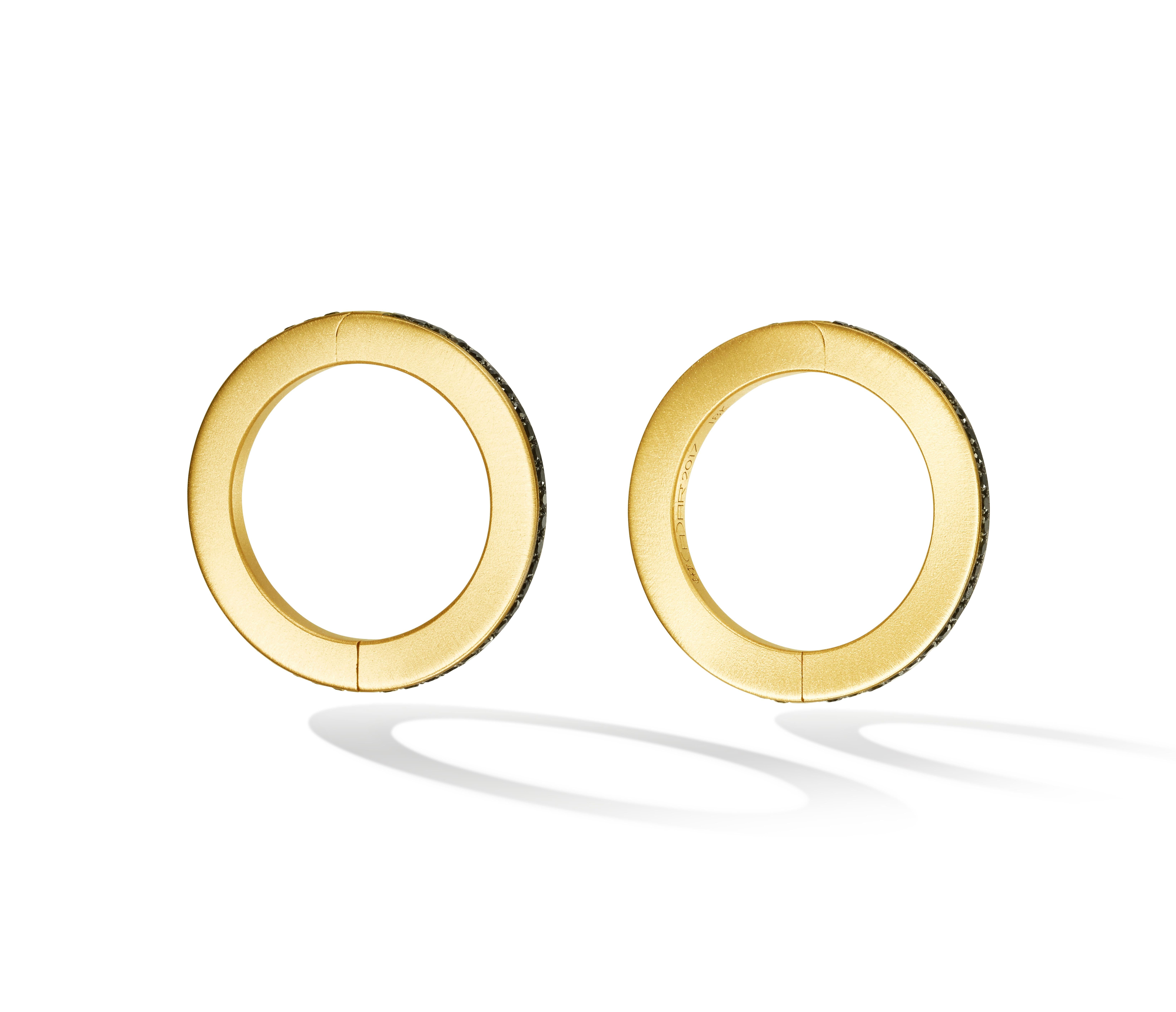 Modern minimalism. A subtle yet statement-making accessory and the perfect holiday gift. Handcrafted in 18K matte finished yellow gold and .96cttw black GVVS-2 diamonds encircling the circular shape of the cufflinks. 

Also available in solid matte