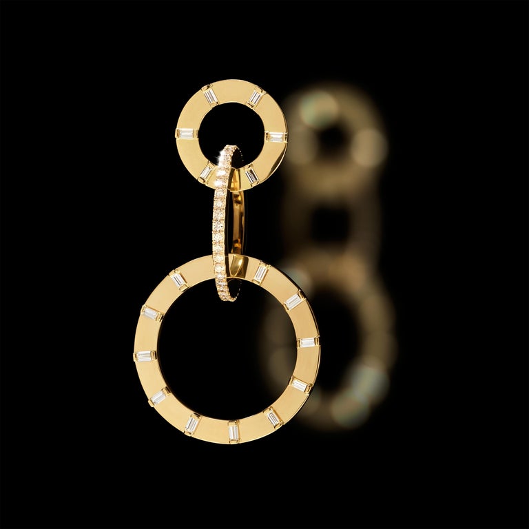 Vibrant, striking trio of light. Linked in harmony and balance, the sun, moon and stars converge in an exquisite tower of discs that fall effortlessly from the ears. Handcrafted in high polished 18K polished yellow gold and 1.94cttw G-VVS2 white