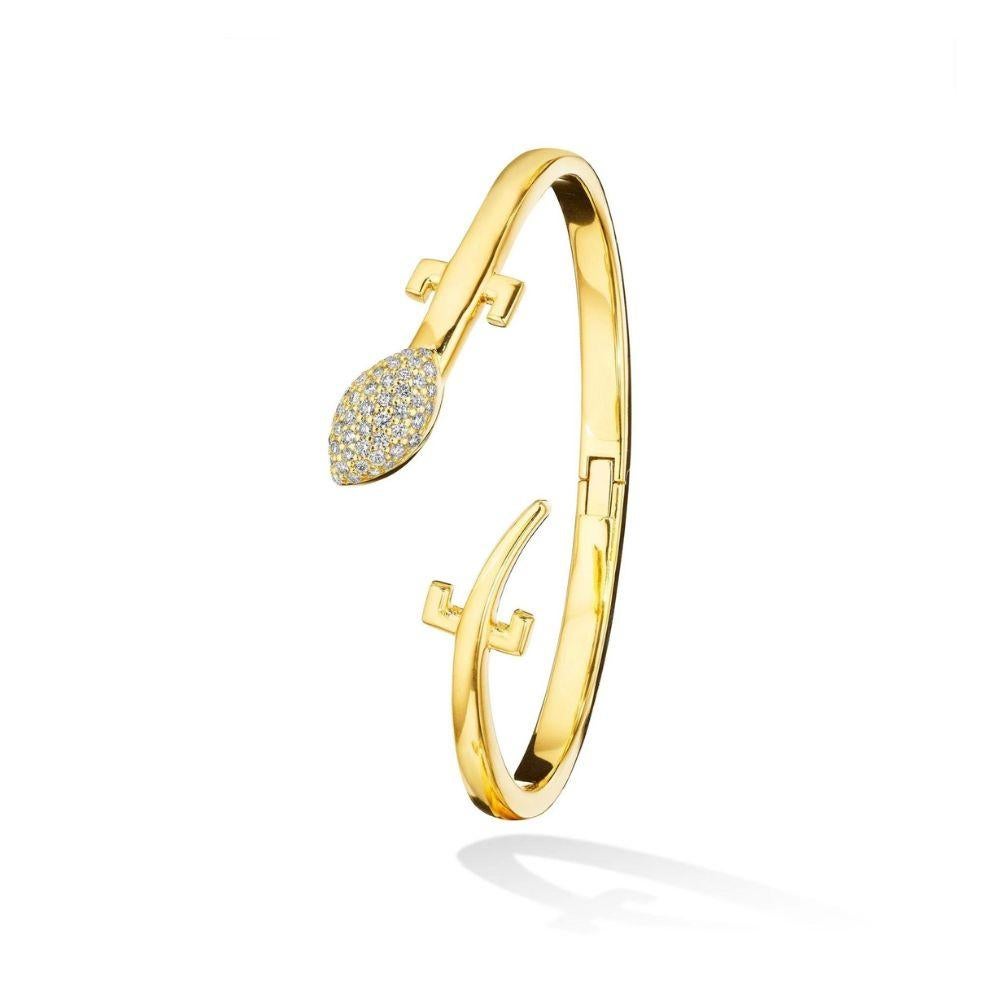 Elevate your style with this 18k gold Origin Single Cuff, a mesmerizing fusion of nature's raw elegance and opulent luxury. Crafted from the finest 18k yellow gold and paved with .47 carats of white diamonds on the head, this bangle exudes