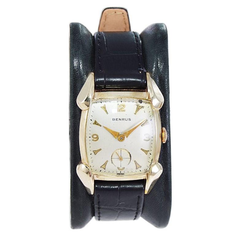 FACTORY / HOUSE: Benrus Watch Company
STYLE / REFERENCE: Tonneau Shape
METAL / MATERIAL: Yellow Gold Filled
CIRCA / YEAR: 1940's
DIMENSIONS / SIZE: Length 39mm X Width 26mm
MOVEMENT / CALIBER: Manual Winding / 17 Jewels / Caliber 66
DIAL / HANDS: