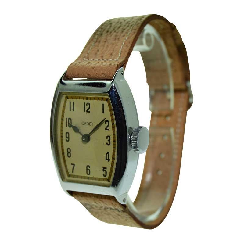 FACTORY / HOUSE: Cadet
STYLE / REFERENCE: Tonneau Shape
METAL / MATERIAL: Steel 
CIRCA / YEAR: 1930's
DIMENSIONS / SIZE: Length 41mm x Width 28mm
MOVEMENT / CALIBER: Manual Winding 
DIAL / HANDS:
ATTACHMENT / LENGTH: Original Leather, 16mm / Regular