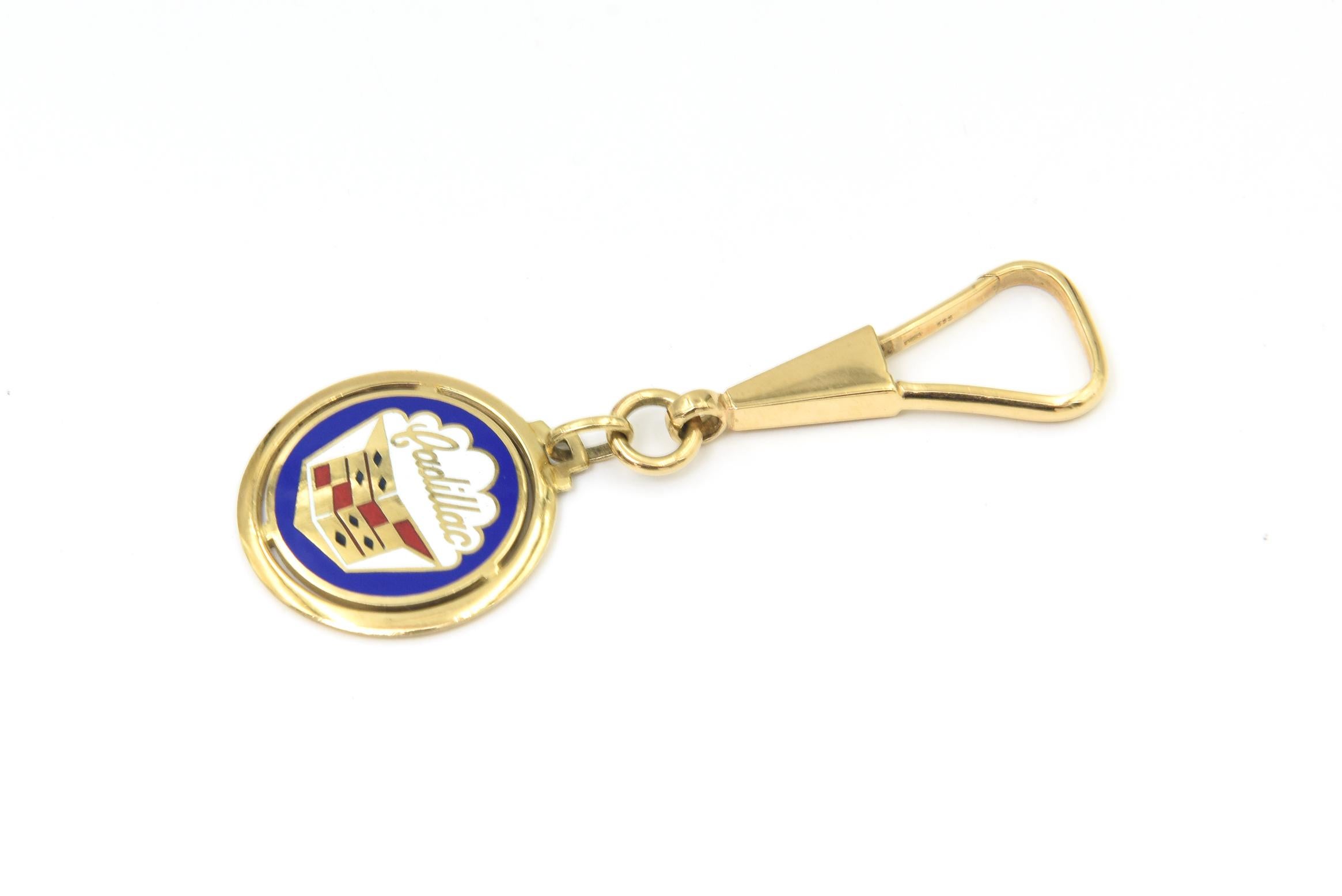 Perfect for the Cadillac enthusiast, this vintage 14k yellow gold keychain features a striking enamel Cadillac emblem at its center. Crafted entirely of solid 14k gold, it has a substantial feel, weighing 20 grams.

A versatile piece, the keyring