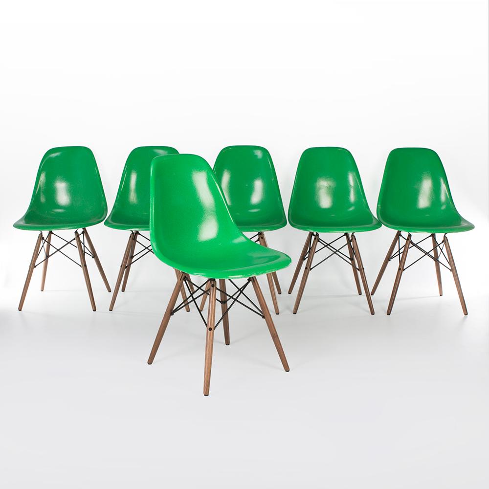An amazing dining set. This set consists of 6 matching cadmium green Herman Miller side shell chairs by Eames look amazing on their used, newer, DSW dowel bases. The strong vibrant colour has not been marred over time and there are no cracks or
