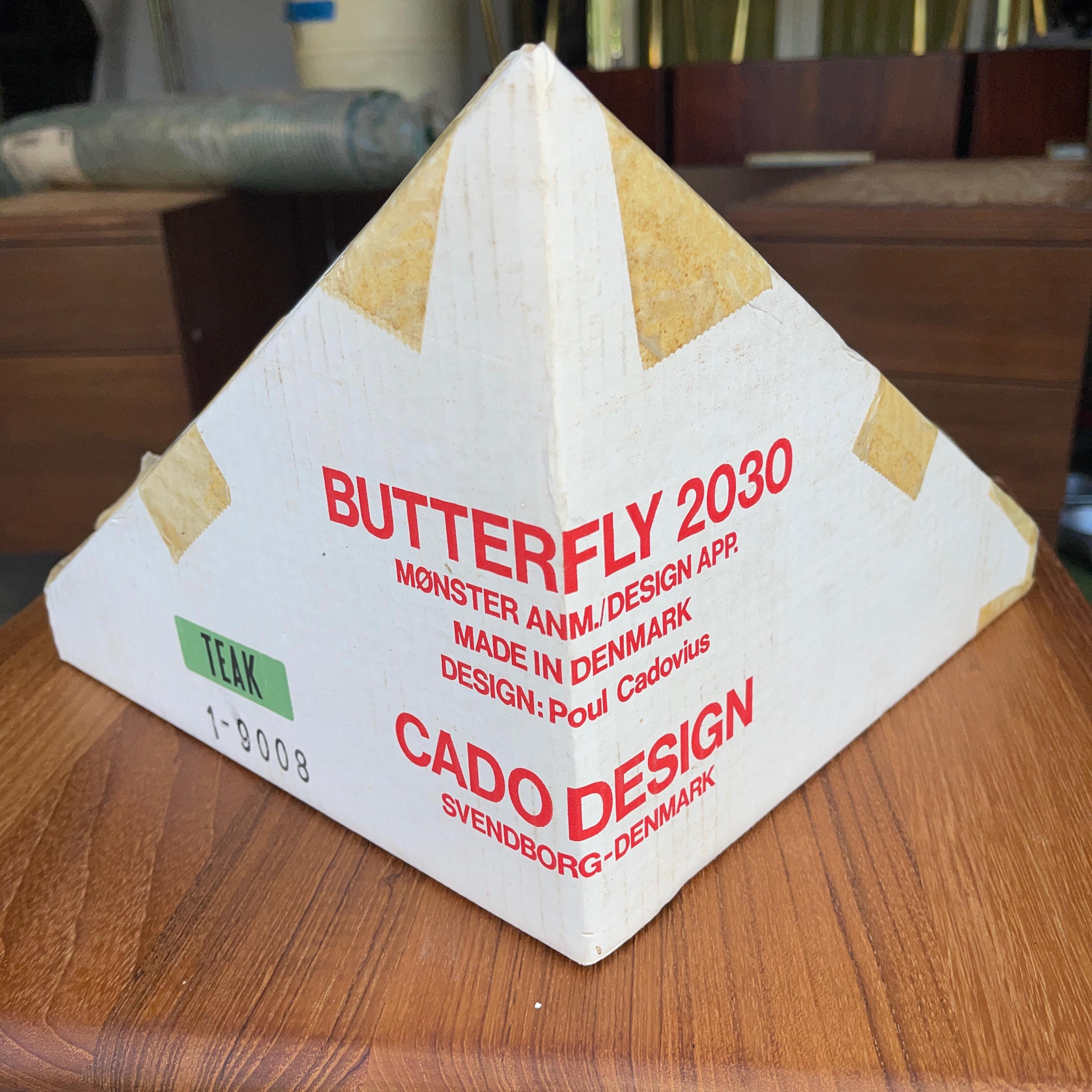 We have 4 original 1960's CADO butterfly wall shelves in teak model 2030 by Poul Cadovious of Denmark.
These are vintage unused New Old Stock. 
Three of the four have never been taken out of their original packaging.
Solid teak > 1/2 inch thick.