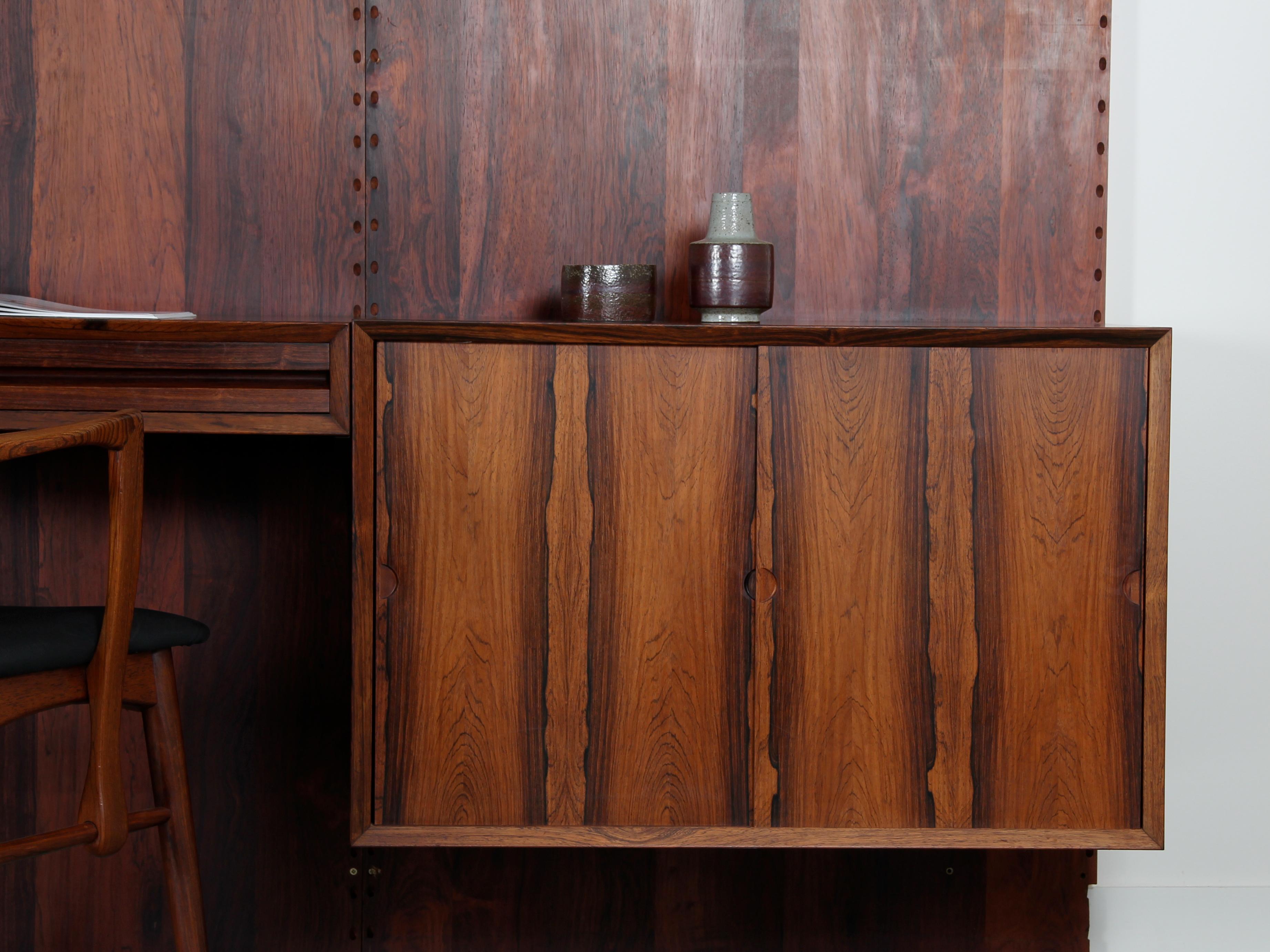Danish Cado Wall rosewood shelving unit by Poul Cadovious For Sale