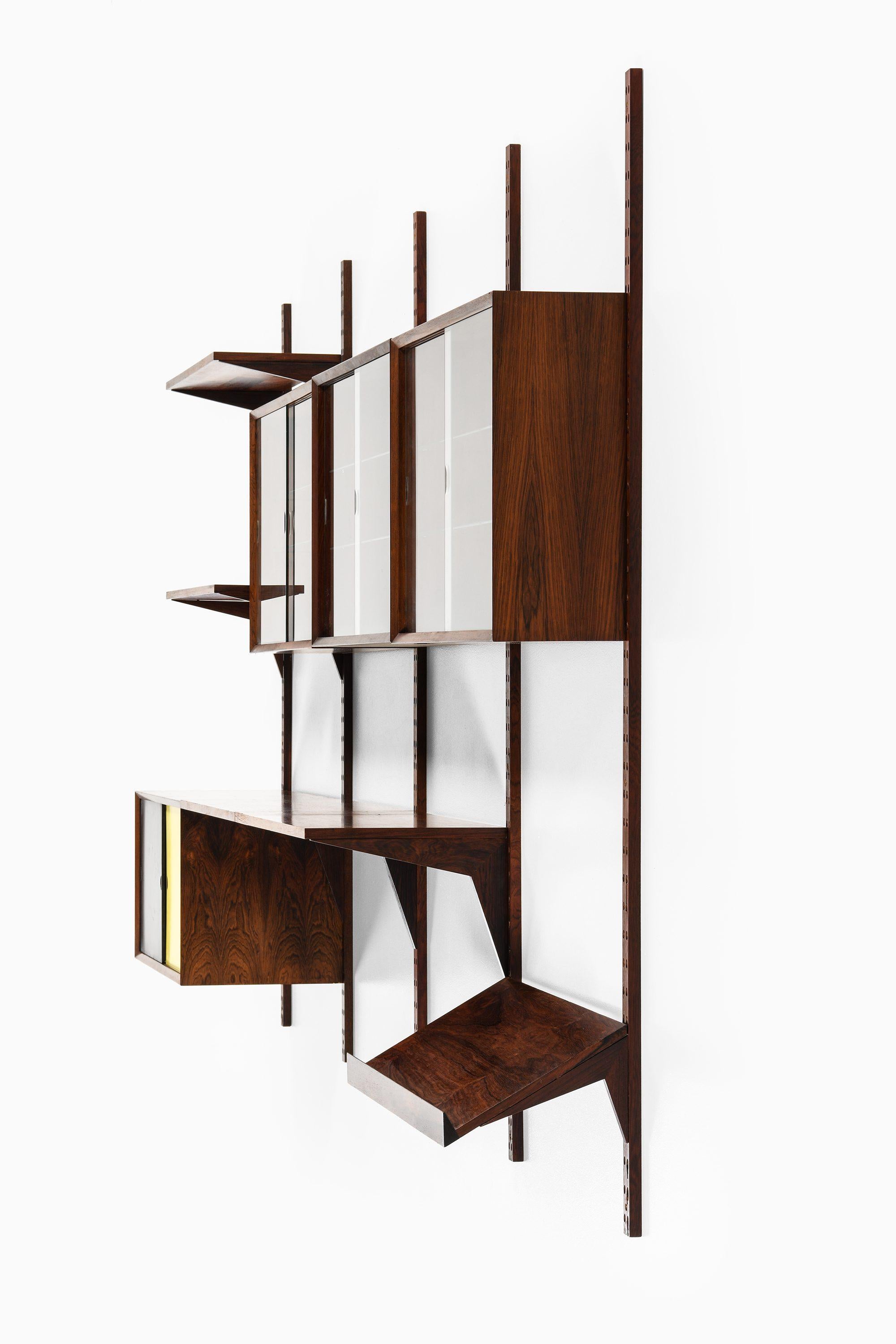 Cado' Wandsystem / Bücherregal aus Rosenholz und Glas von Poul Cadovius, 1960er Jahre

Zusätzliche Informationen:
MATERIAL: Palisanderholz, Glas
Stil: Mitte des Jahrhunderts, skandinavisch
Produziert in Dänemark
Abmessungen (B x T x H): 320 x 40 x