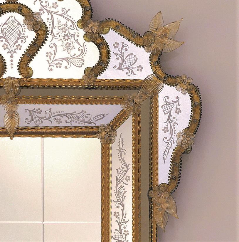 Venetian style mirror made from a design by Fratelli Tosi, in murano glass, entirely hand made according to the techniques of the glass masters of the fourteenth century, decorated with
Floral and curly engravings, silvered with pure silver, with a