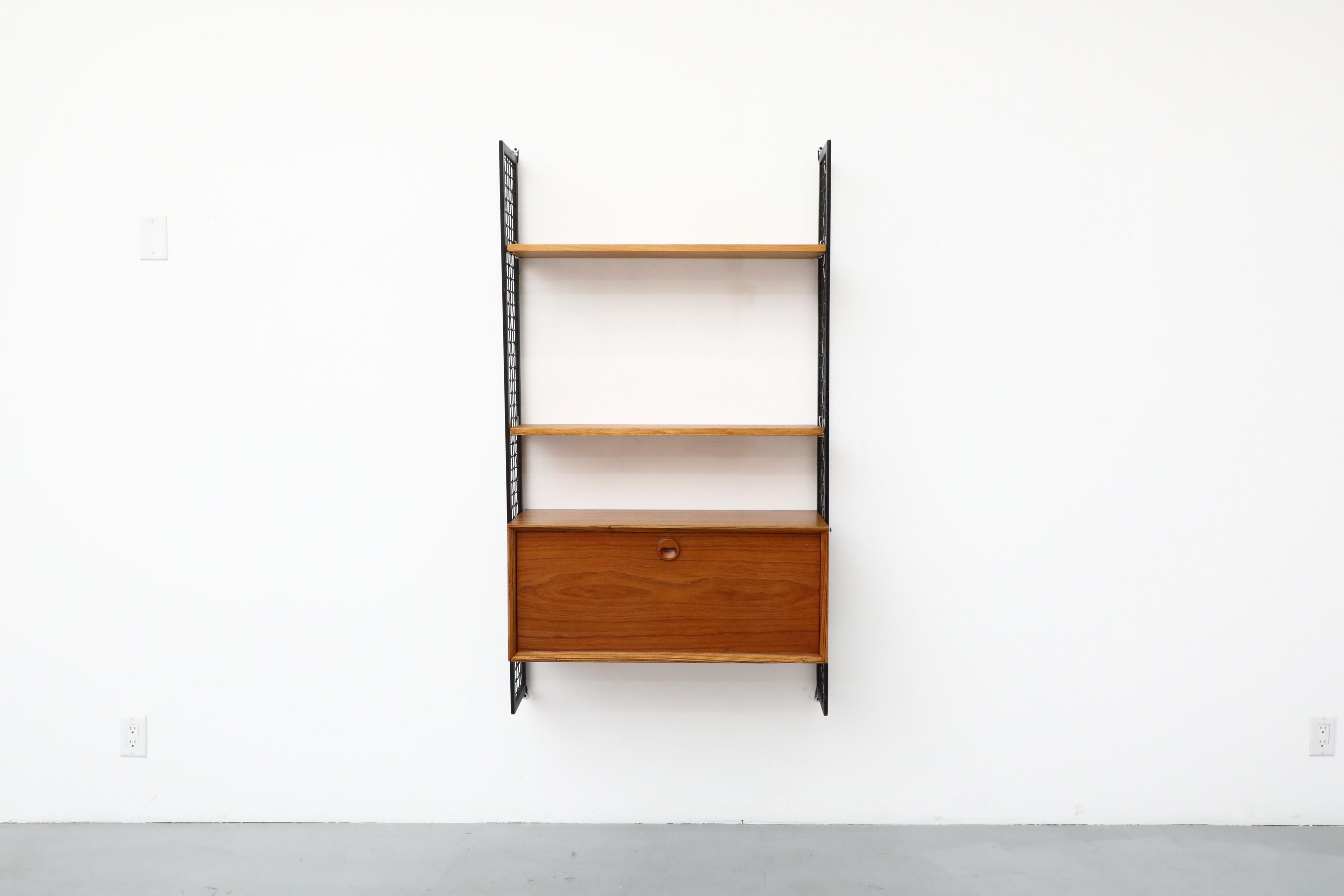 Cadovius Style Mixed Wood Wall Unit with Black Enameled Metal Grid Risers In Good Condition In Los Angeles, CA