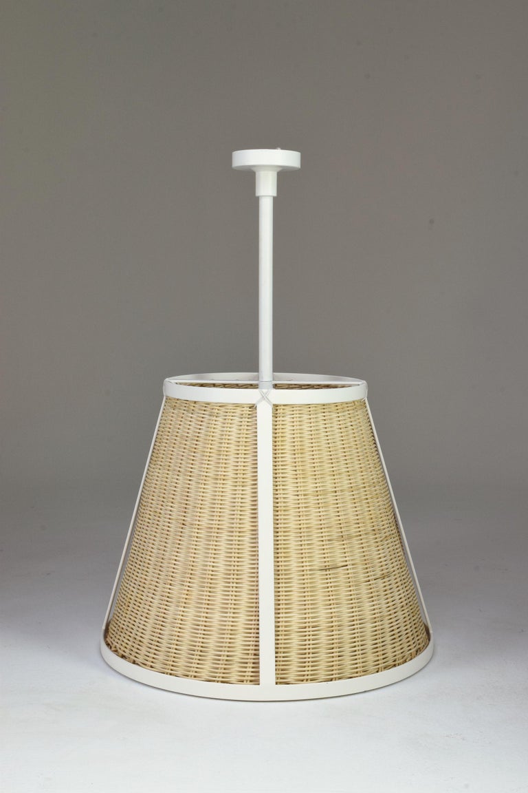Contemporary handcrafted made-to-measure pendant light fixture composed of a painted steel structure and a meticulously handwoven rattan shade. Also available in brass. 
Perfect for big living areas or as kitchen island lights. 

LED bulb 12W