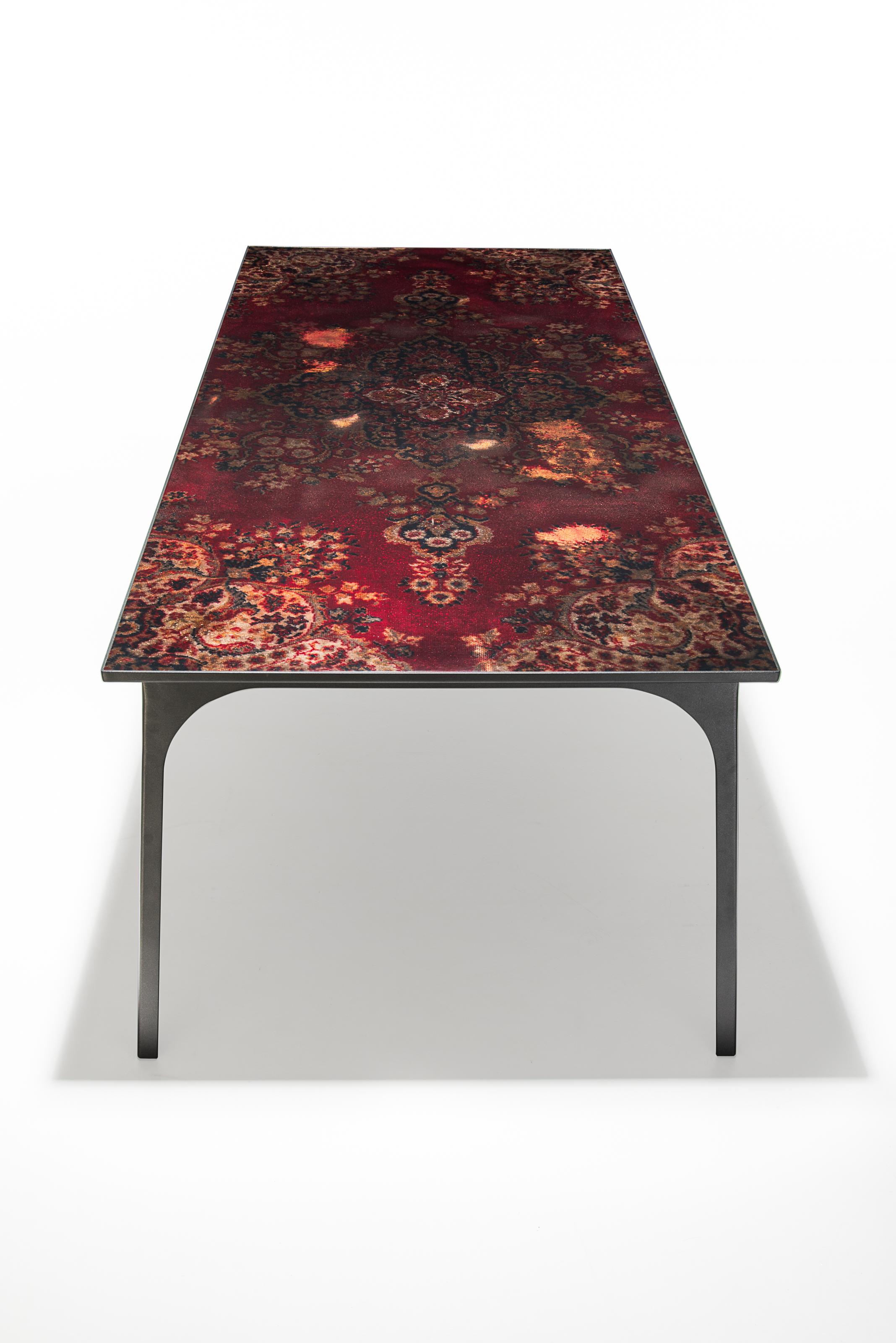 Café 6116 is an award-winning design by Atelier Ruben van Megen; a Dutch designer who designs conversation pieces. The table is inspired by and made of Persian carpets.

The table refers to the Golden Age, when Persian carpets made their