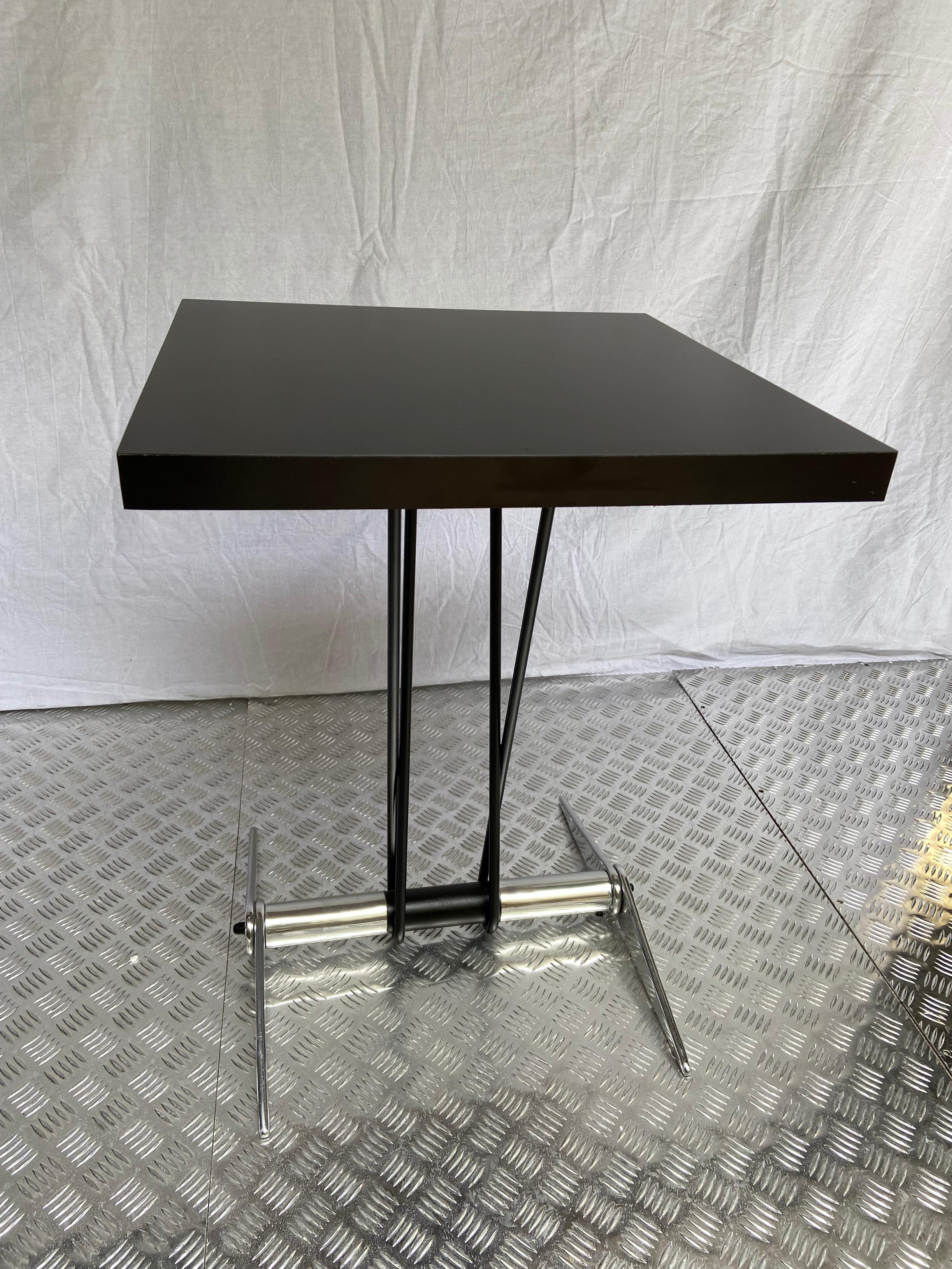 Cafeteria table - Jean Prouvé - 1938

Black melamine recently redone
Black lacquered steel structure and aluminum base
Measures: 54.5 x 54.5 x 73 cm.
 