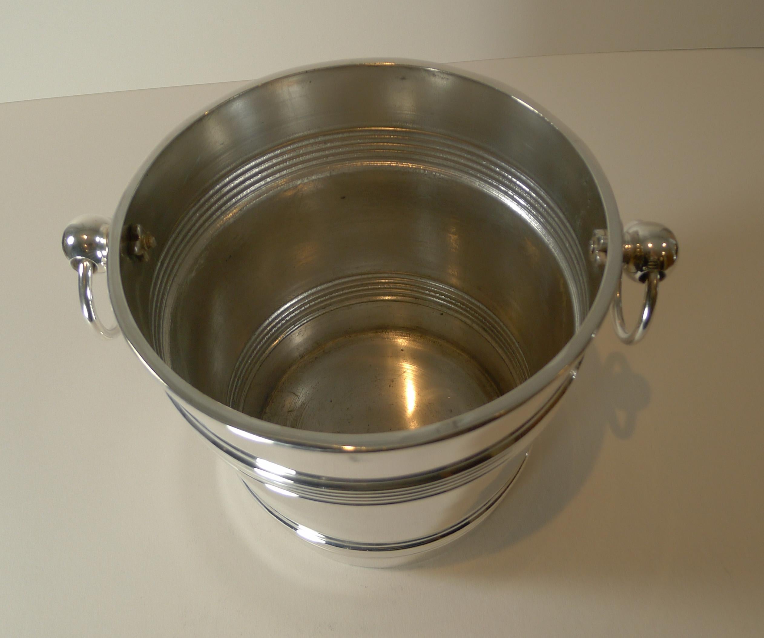 A magnificent and rare silver plated champagne bucket with removable cover, made by the top notch French silversmith, Cailar Bayard of Paris, fully marked on the underside.

Cailar & Bayard, 37 rue Grange-aux-Belles, Paris, founded in 1848 by Noel