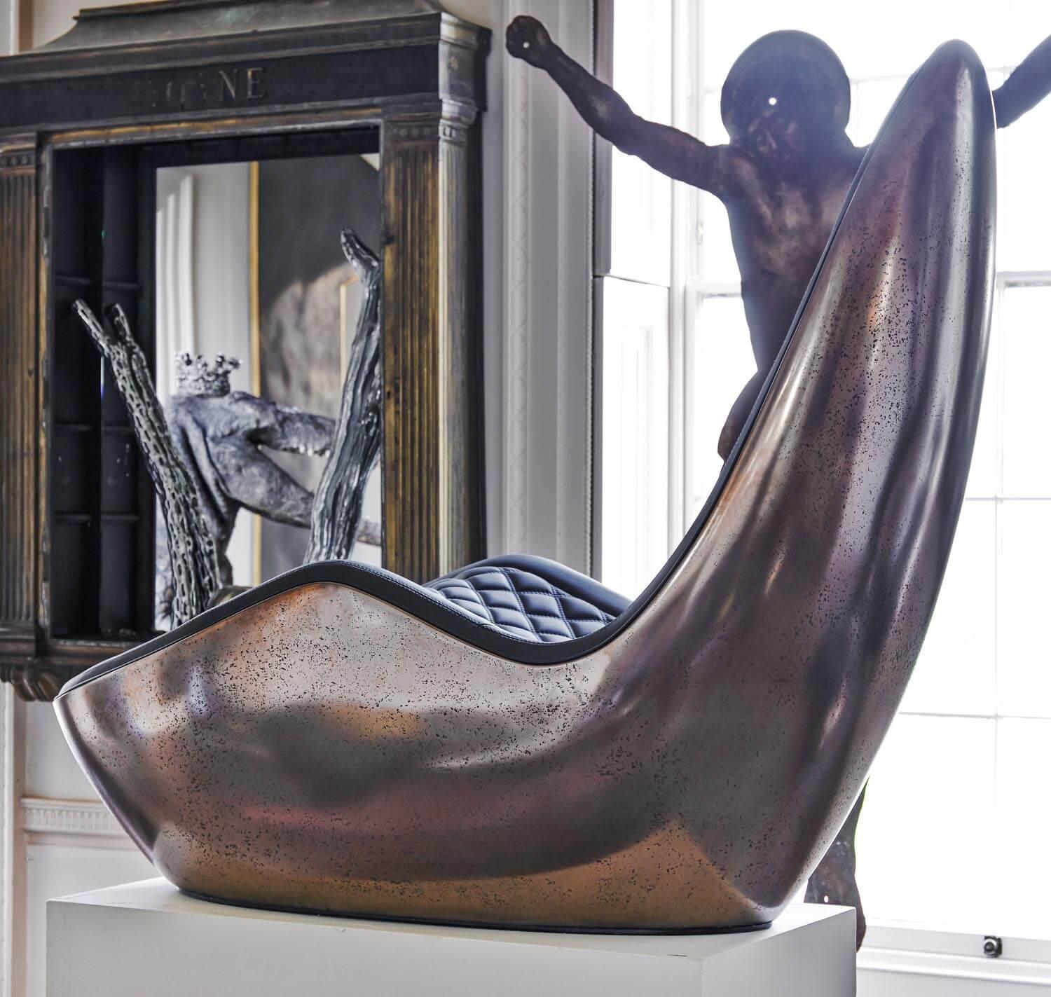 CAILLOU CHAISE

 

ROUSSEAU’S WORK INVITES THE OBSERVER TO APPRECIATE THE CHAISE NOT MERELY AS A SEATING OPTION BUT AS AN ART OBJECT. THE TACTILE EXPERIENCE OF THE PIECE—THE SMOOTHNESS OF ITS SURFACE, THE SEAMLESS FLOW OF ITS FORM—SPEAKS TO A