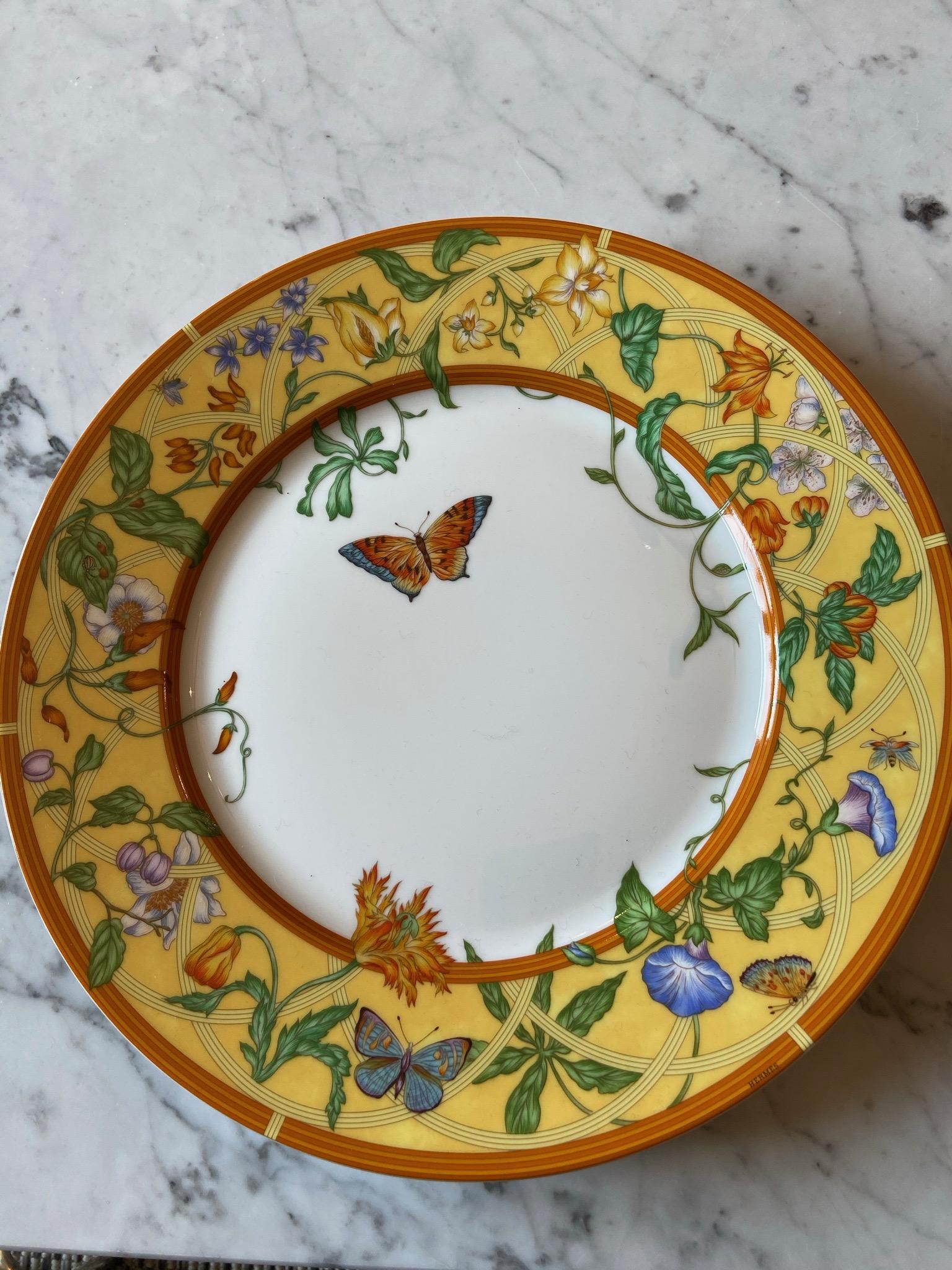 Cake/ dessert plate from Siesta Collection Hermès Paris, made with fine porcelain from Limoges France. The plate is designed with beautiful floral decors, in the yellow and orange tones. It is signed on the back. The plate is new and comes with its