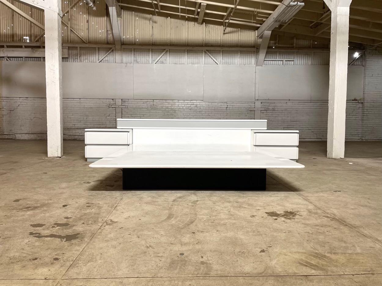 General dimensions as pictured

W 130.5 D 98.5 H 35

54.5 D 76 W 10 H- base platform alone once surface platform is removed (see final picture)

Total width including nightstands 130.5 inches.

Headboard alone W 95.5 D 12 H 35

Nightstand