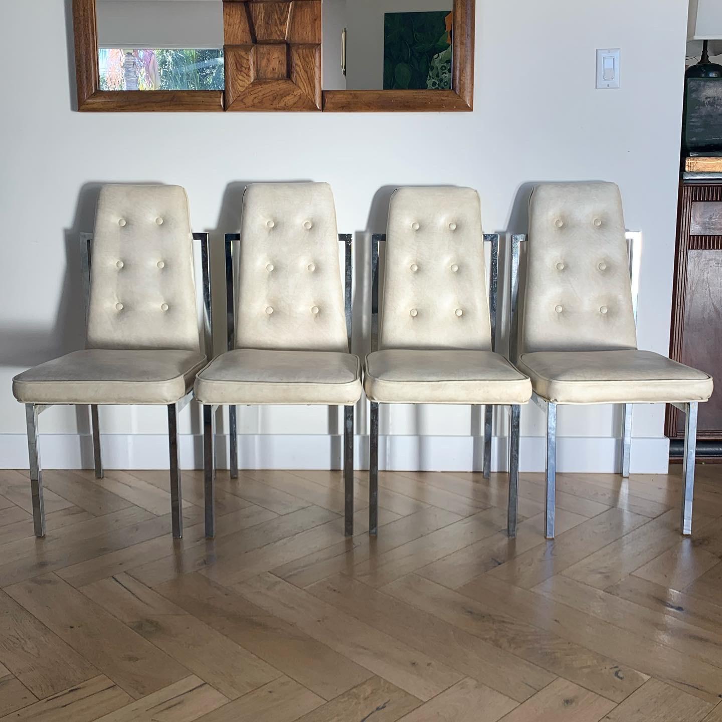 Set of 4 Cal-Style dining chairs in original ivory leather with chrome frames. Fab geometry and button chic classic to Cal-Style. Leather folds over the back of chair. Circa early 1970s. Great condition with minor signs of age noted in slides. .