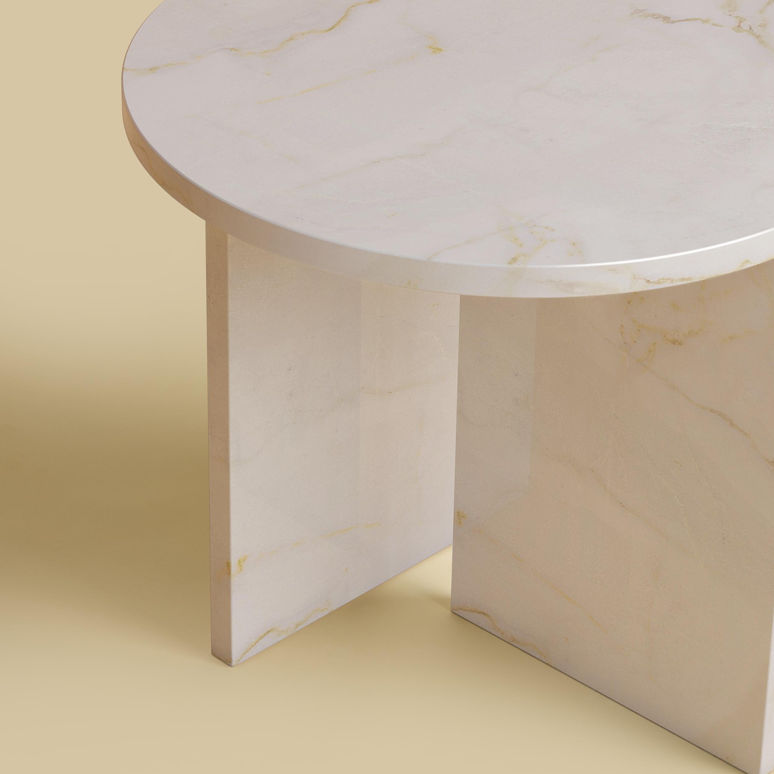 The Kyushu coffee table is made entirely of calacatta gold marble. The top is circular and 45cm in diameter. Elevate your space with the luxurious Calacatta Gold Marble Side Table. Crafted entirely from premium Calacatta marble, this exquisite side