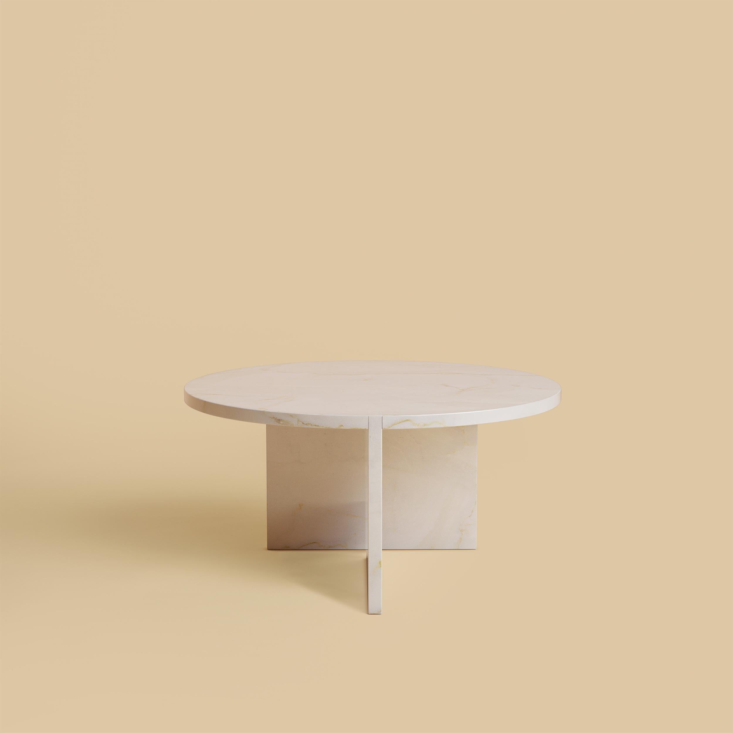 The Hashi coffee table is made entirely of Italian calacatta gold marble from Tuscany. The top is circular and 60 cm in diameter, the legs are made from two marble boards in which one part is inlaid on the top as a very elegant detail.
Artisanal