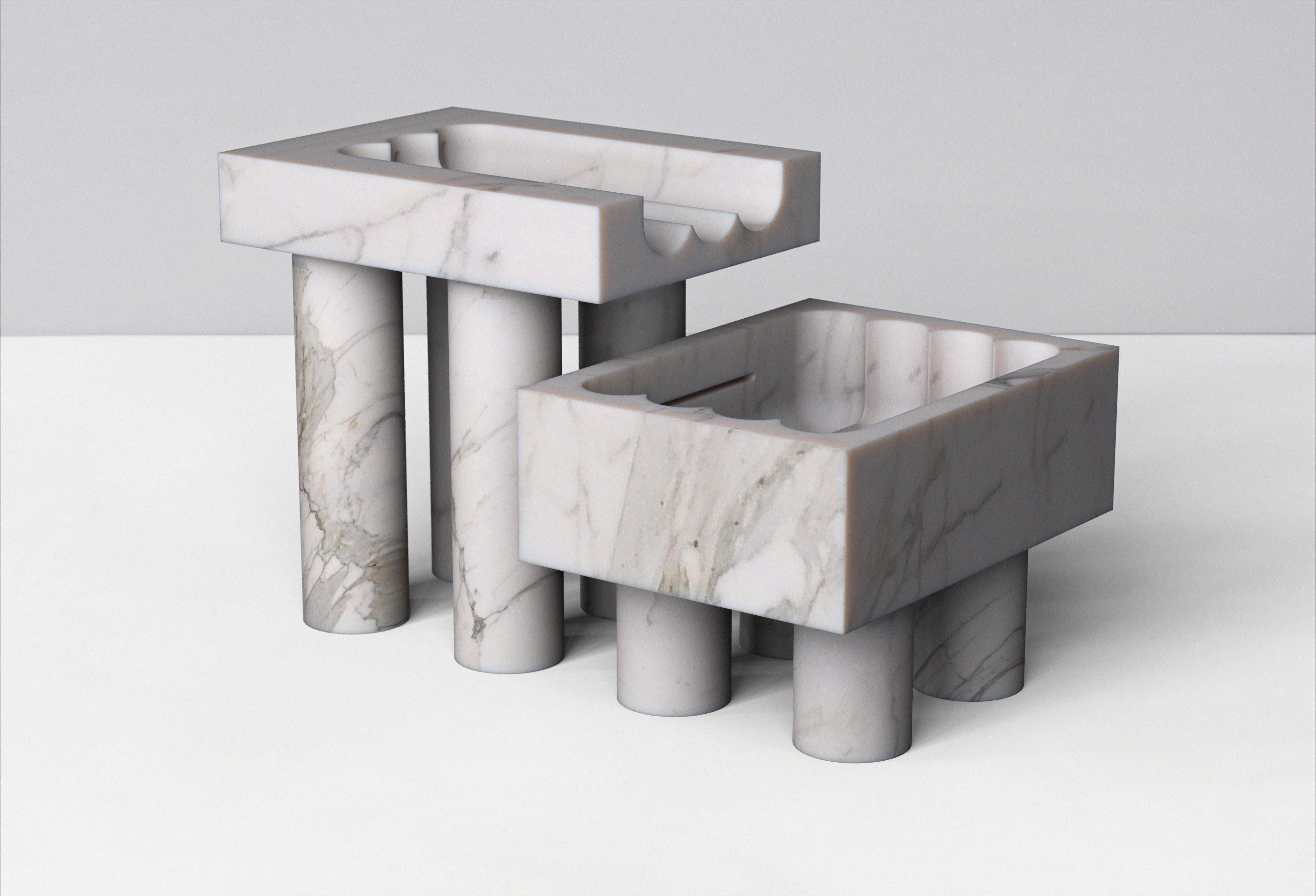 Calacatta marble Monolithic font by Tino Seubert.
Dimensions: D 100.5 x W 61 x H 62.1 cm.
Materials: Calacatta marble.

Tino Seubert
When he first made his now signature wicker and aluminium stools and benches in 2018 for a show at the Hepworth