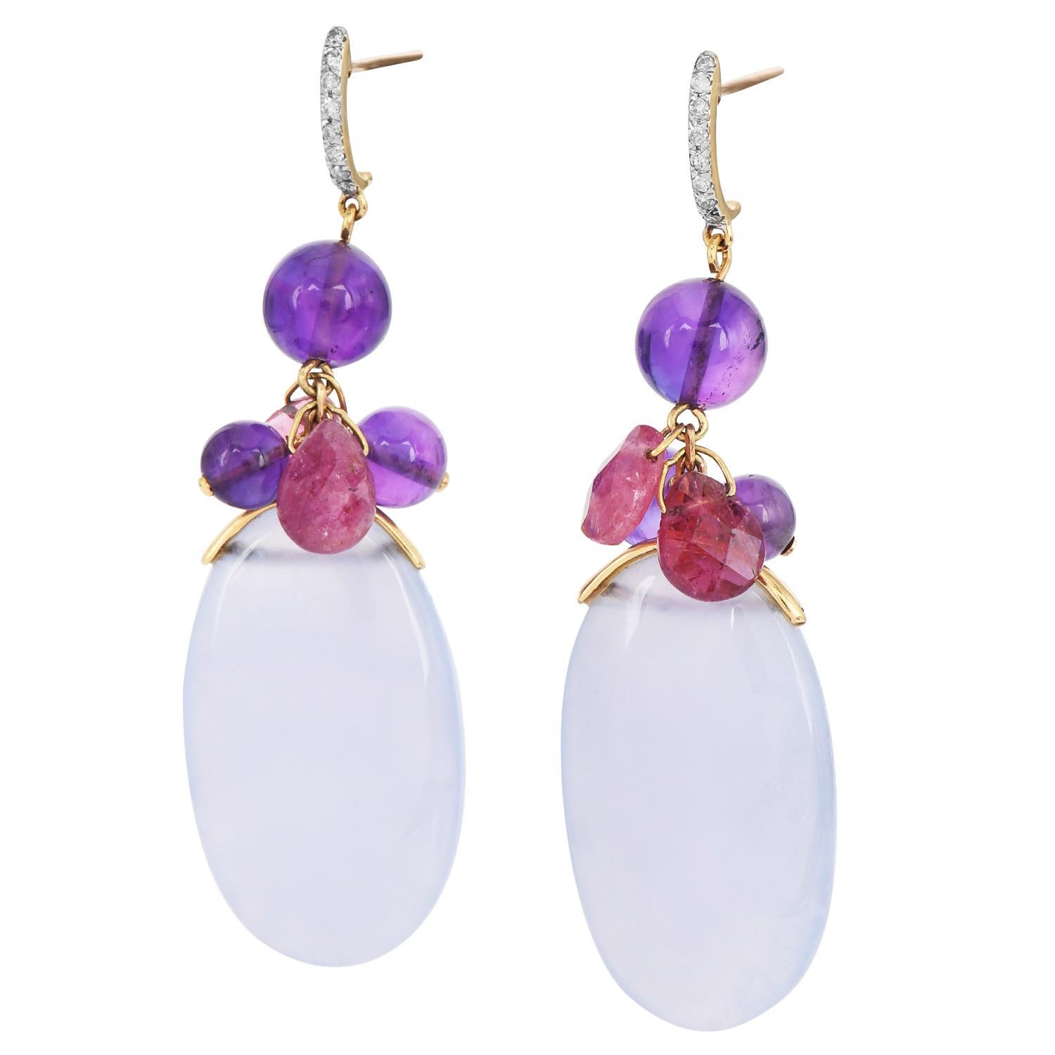 These funky Calcedony Gem, amethyst, turmaline and diamond dangle earrings are crafted in solid 18K yellow gold. Dangle earrings feature 6 amethyst beads approx. 10.00 carats each connected to Pear double sided carved turmalineand two large