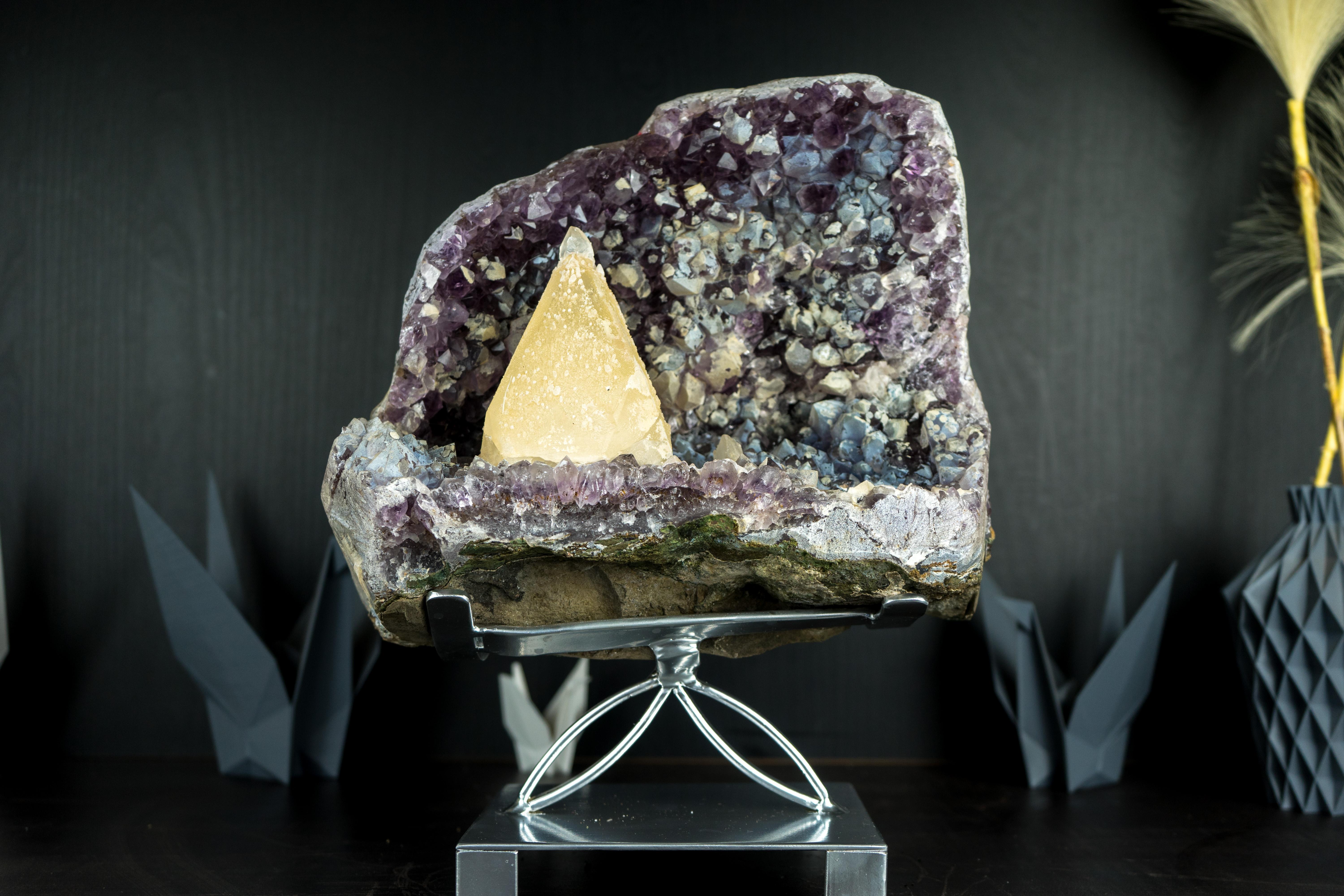 A rare calcite specimen from the famous Brazilian Toldinho Mine, this magnificent, museum-quality piece sits beautifully on a bed of amethyst, forming a mineral masterpiece that will surely find its way into a renowned collection or become the
