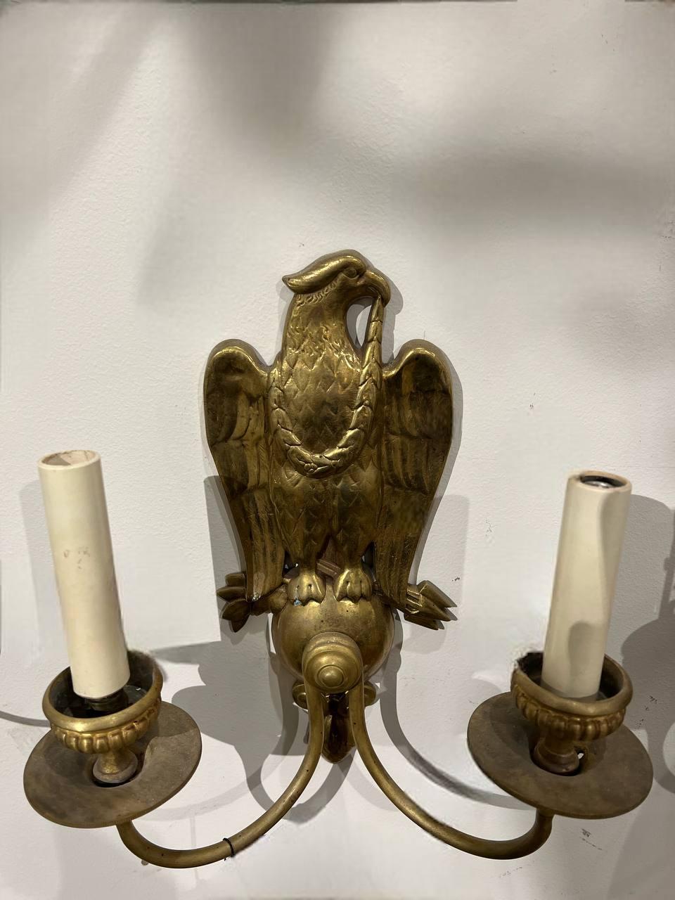 A pair of circa 1920’s gilt bronze federal style double arm sconces. Available in silver plate 