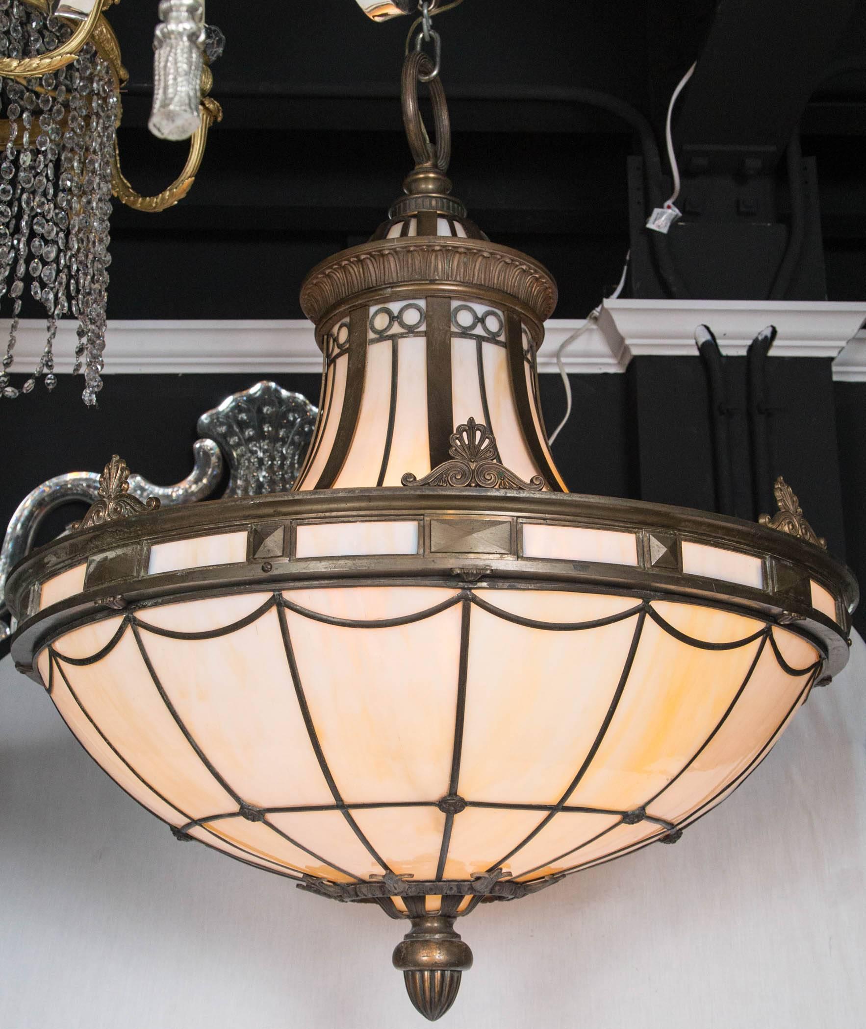 A Caldwell neoclassic style light fixture with interior lights, circa 1920.