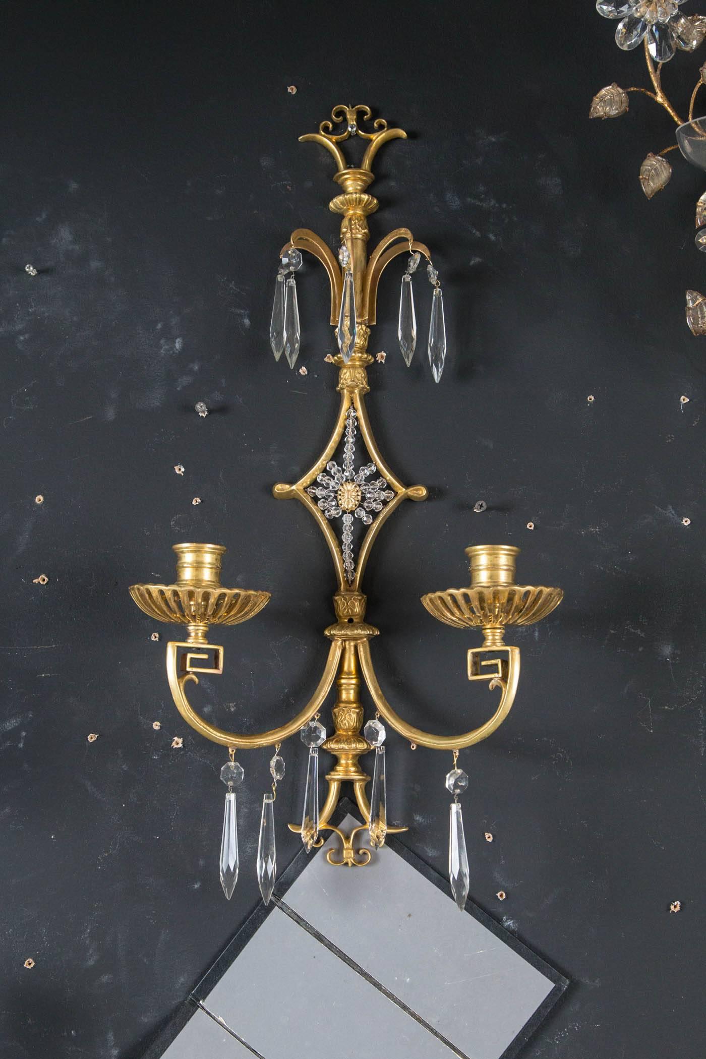 A set of eight circa 1920 Caldwell sconces with crystal hangings.