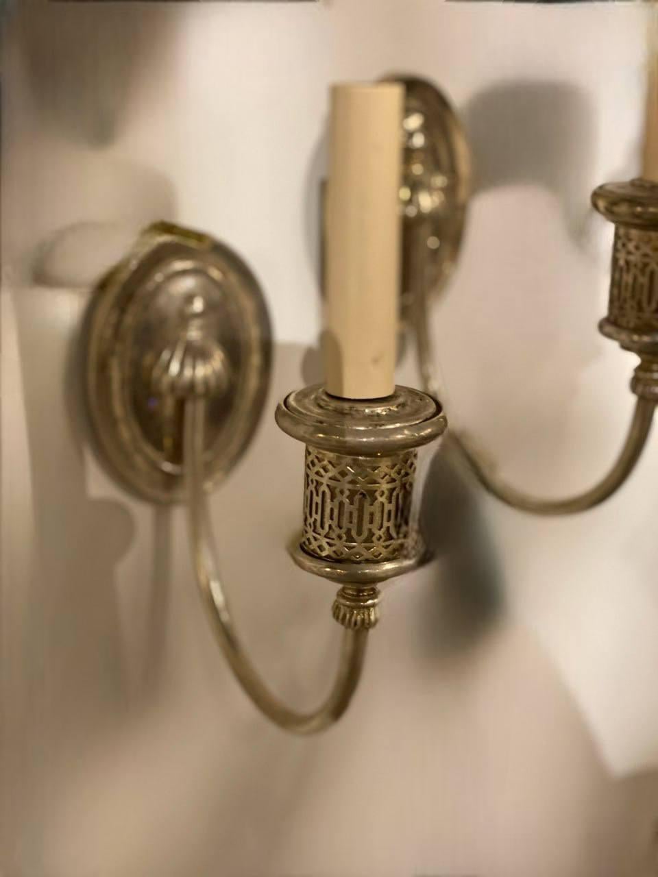 A pair of 1920 silver plated one light sconces 