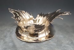 Splash - Escultura de bronce pulido de agua salpicando congelada en el tiempo