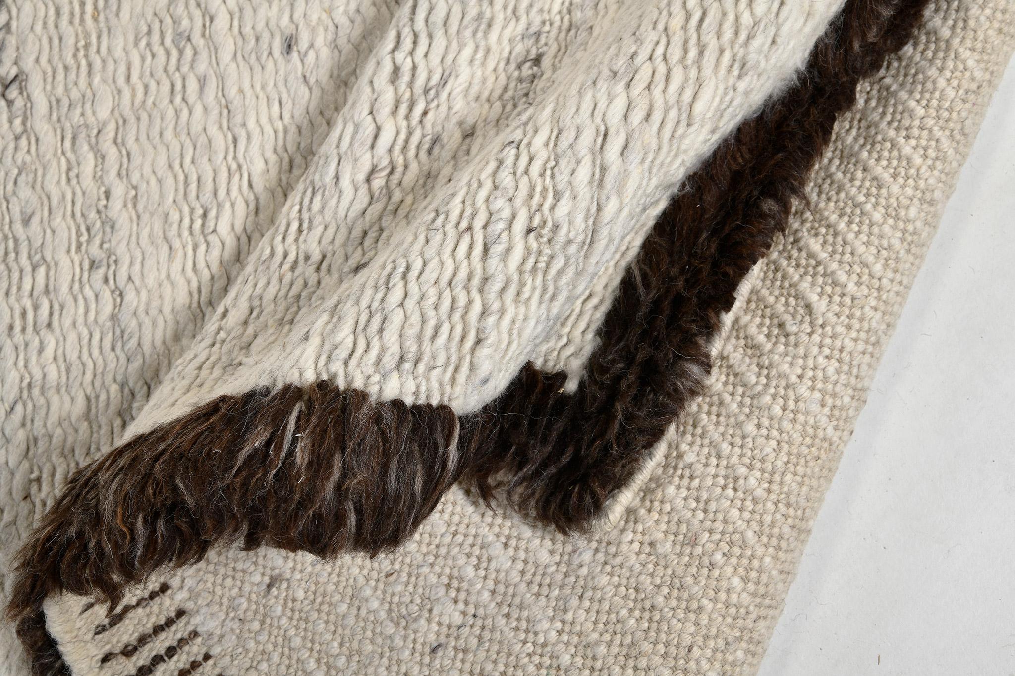 A minimalist collection from India, under Sabbia Collection, Caleta, has a rancho color scheme and interesting design with chocolate solid border that complements with the embossed ivory pile weave. It can elevate your space and makes your space