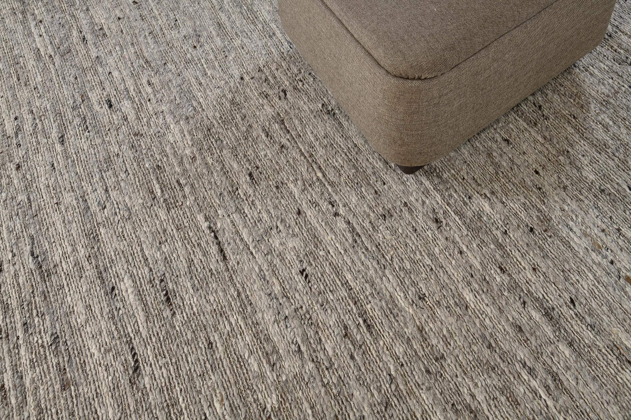 A sophisticated minimalist rug under Sabbia Collection, Caleta, that has a gray color and solid design with no borders that complements with the embossed pile weave. It can elevate your space and makes your space looks luxurious and superb. Textures