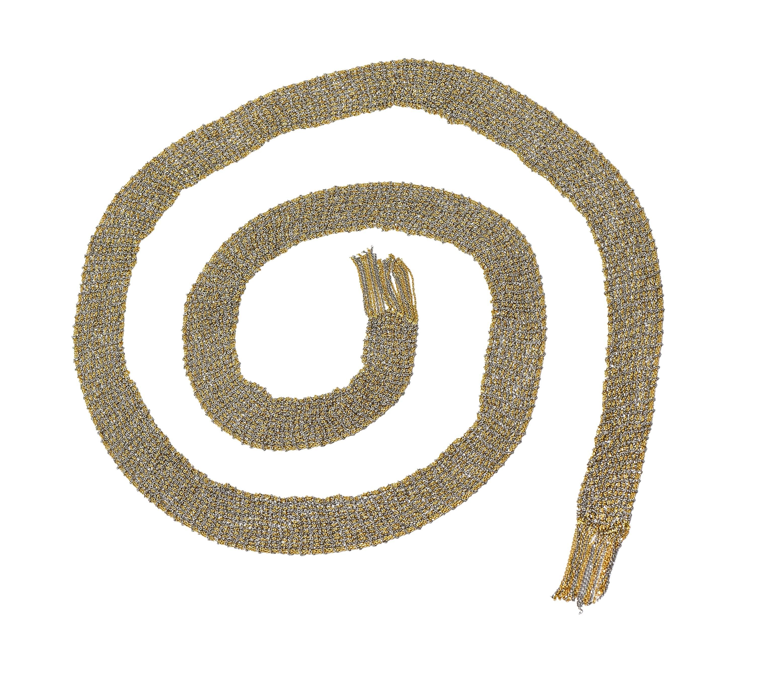 Comprised of finely woven yellow and white gold chain mesh 
Scarf-style with open fringed terminals 
Stamped with Italian assay marks for 18 karat gold
Fully signed for Calgaro
Circa: 2000s 
Width at widest: 3/4 inch
Length: 42 3/8 inches
Total