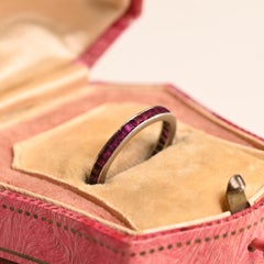 Calibre Cut Ruby Channel Set Eternity Band, Platinum