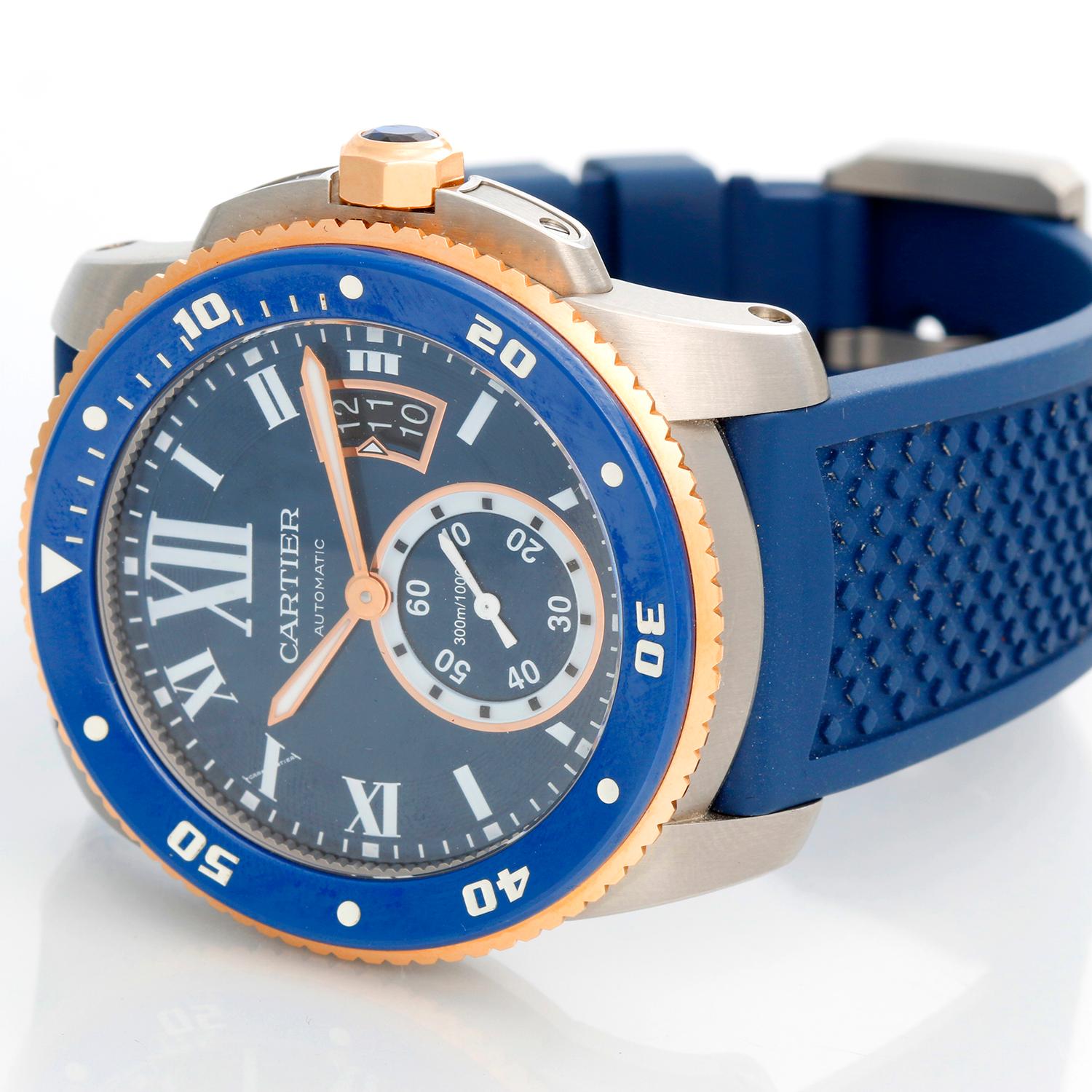 Calibre de Cartier Diver Men's Large 18k Rose Gold & Steel  Watch W2CA0009 - Automatic winding with date. Stainless steel case with 18K Rose gold and blue rotating bezel  (42mm diameter). Blue dial dial with white  Roman numerals and stick markers;