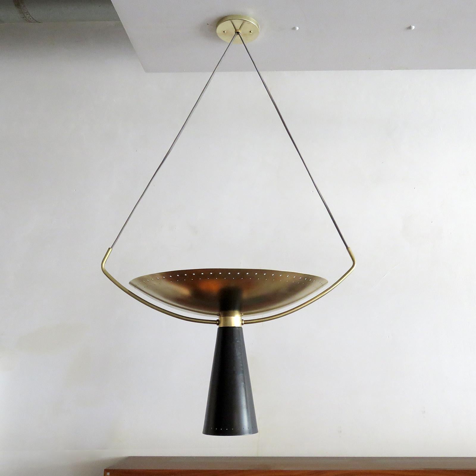 Wonderful two tone pendant light 'Calice-18' designed by Gallery L7, handcrafted and finished in Los Angeles from American brass, suspended with a perforated, aged brass up-light disc and a black enameled down-light cone. Four E26 sockets per