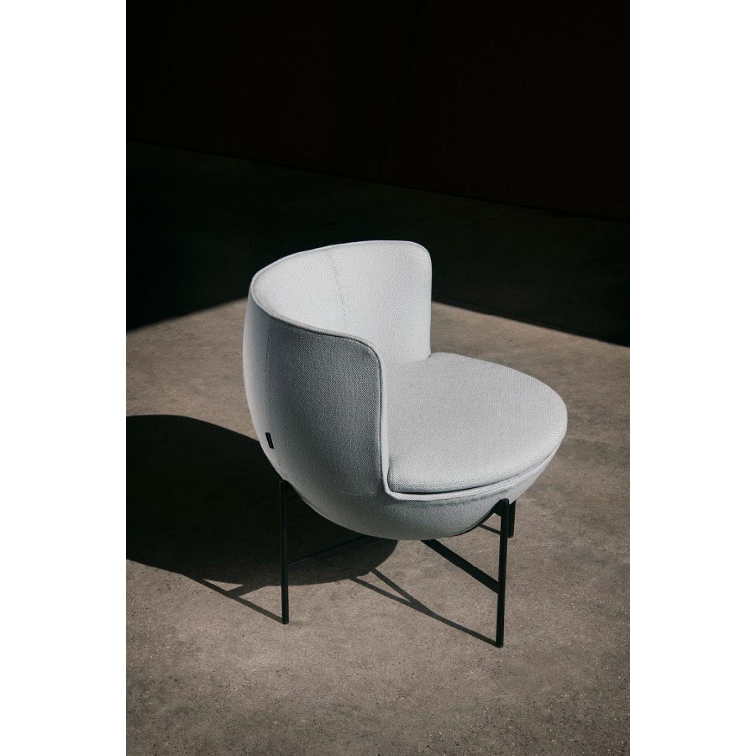 Calice armchair four-leg base by Patrick Norguet
Materials: Upholstery: Fabric or leather
Structure: Black powder-coated metal or matte champagne and black chrome
 
Dimensions: W 72.8 x D70.7 x H 71.6 cm
 HS 43.7 cm

The Calice armchair owes