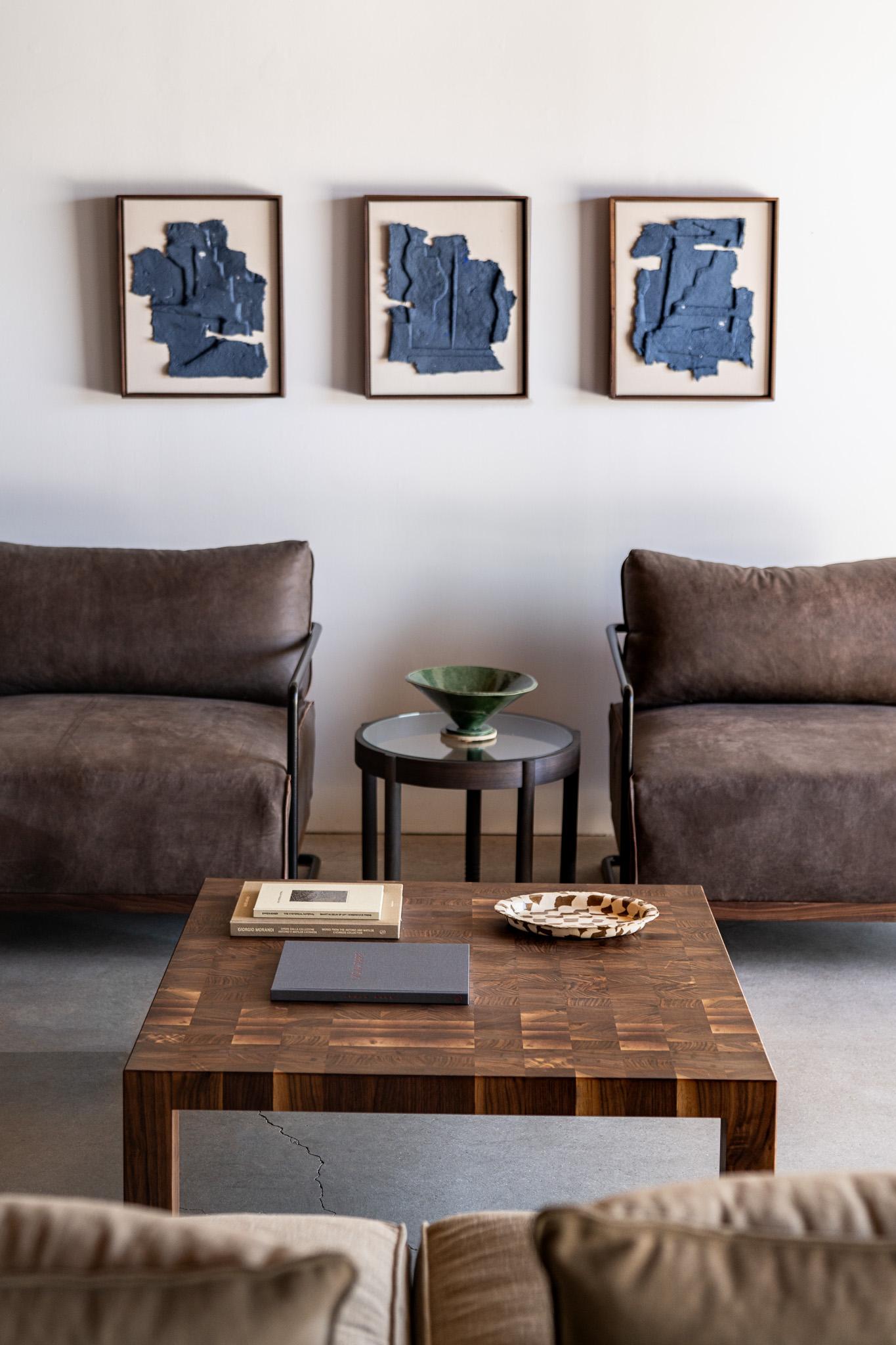 The Calico Coffee Table celebrates both material and method by transforming end grain walnut into a mesmerizing landscape. Each carefully positioned block creates a rich, textural mosaic that catches light and shadow in a dance of warm brown